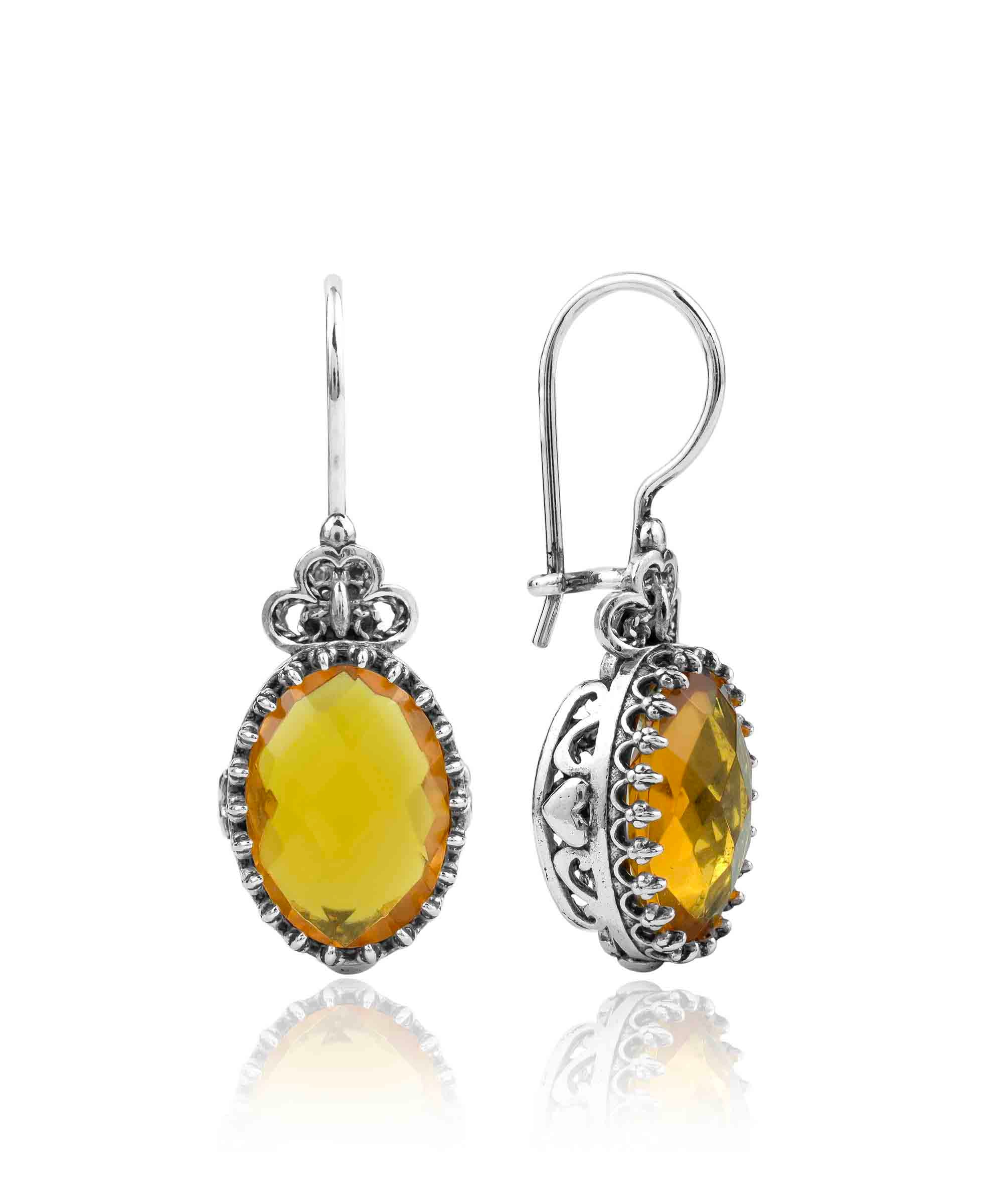 Elegant filigree art silver drop earrings featuring a heart design and a vibrant citrine gemstone.