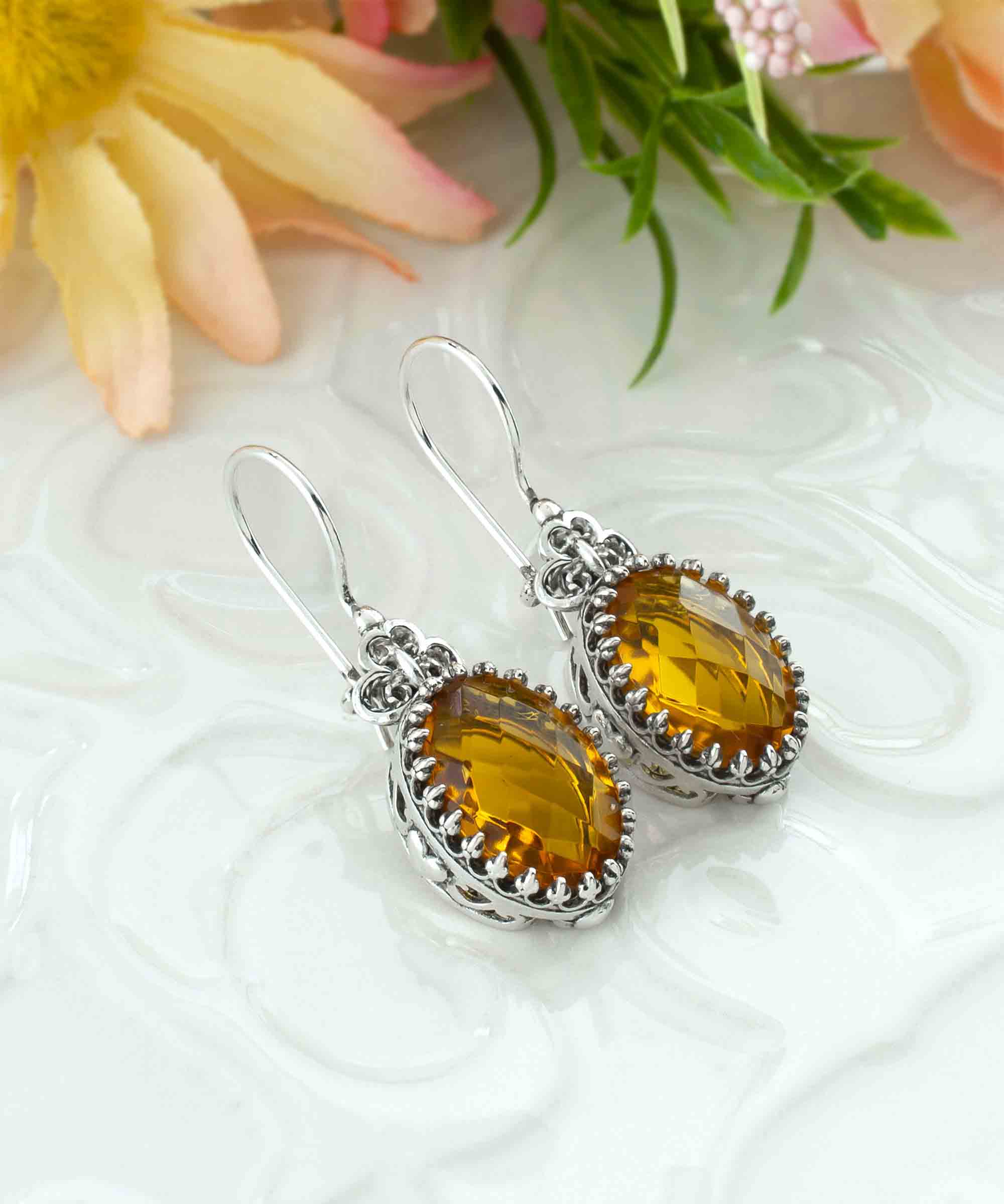 Elegant filigree art silver drop earrings featuring a heart design and a vibrant citrine gemstone.