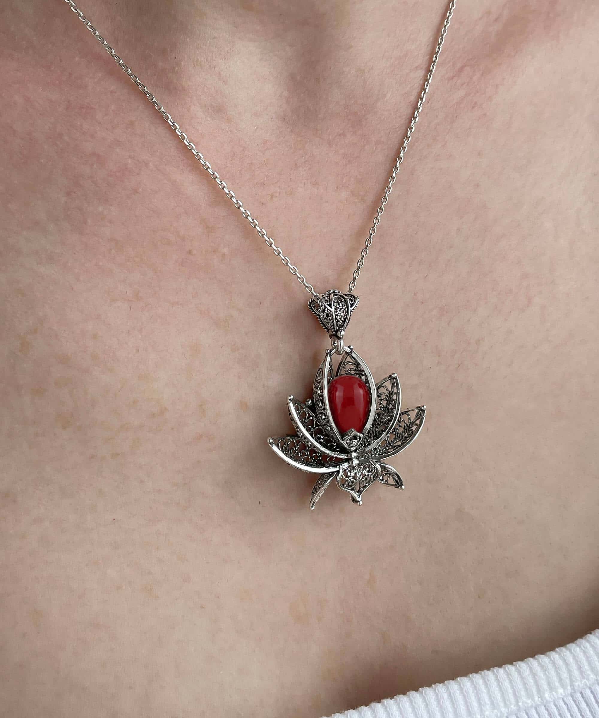 Elegant 3D lotus flower pendant made of 925 Sterling Silver with coral gemstone, showcasing intricate filigree art.