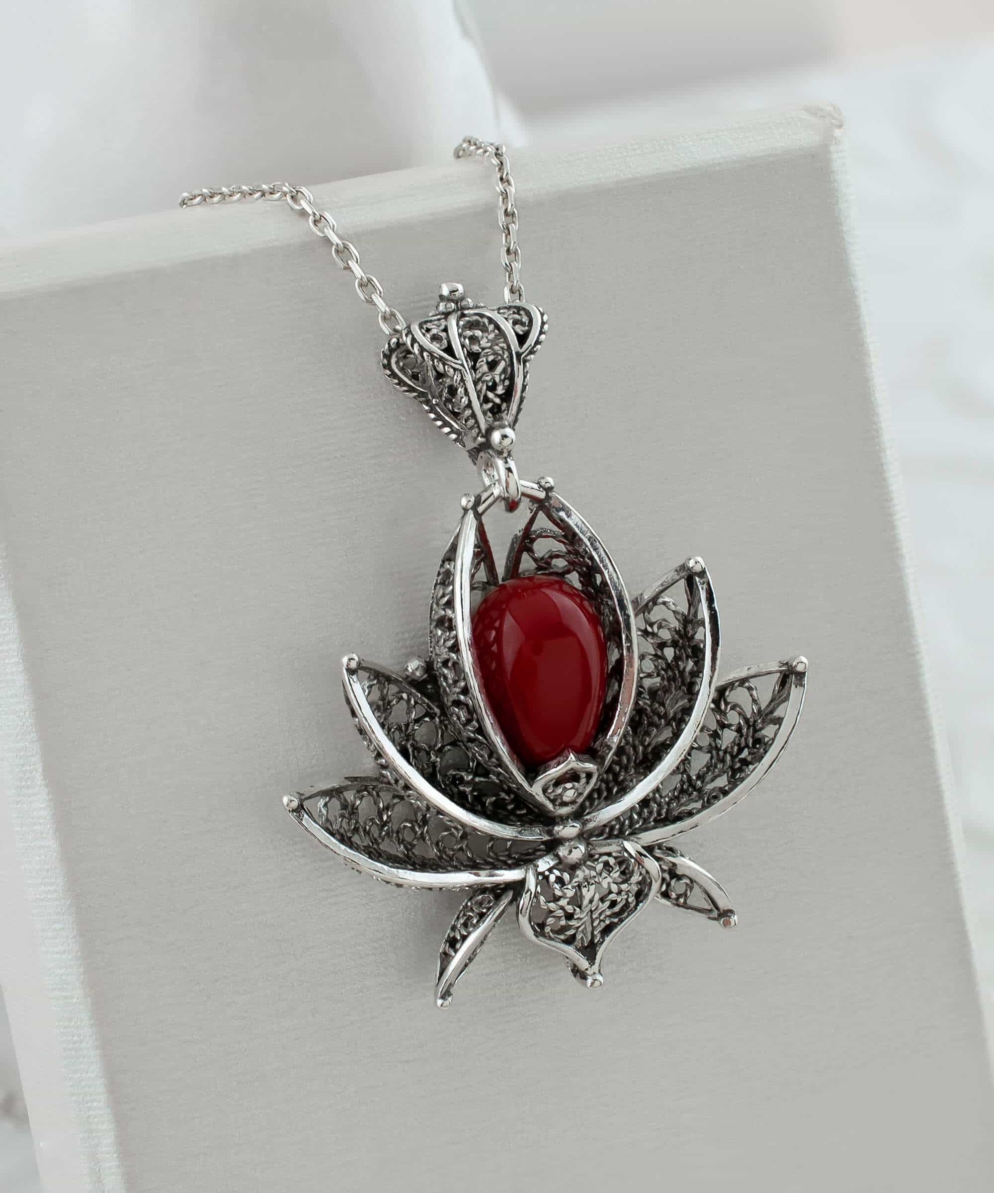 Elegant 3D lotus flower pendant made of 925 Sterling Silver with coral gemstone, showcasing intricate filigree art.