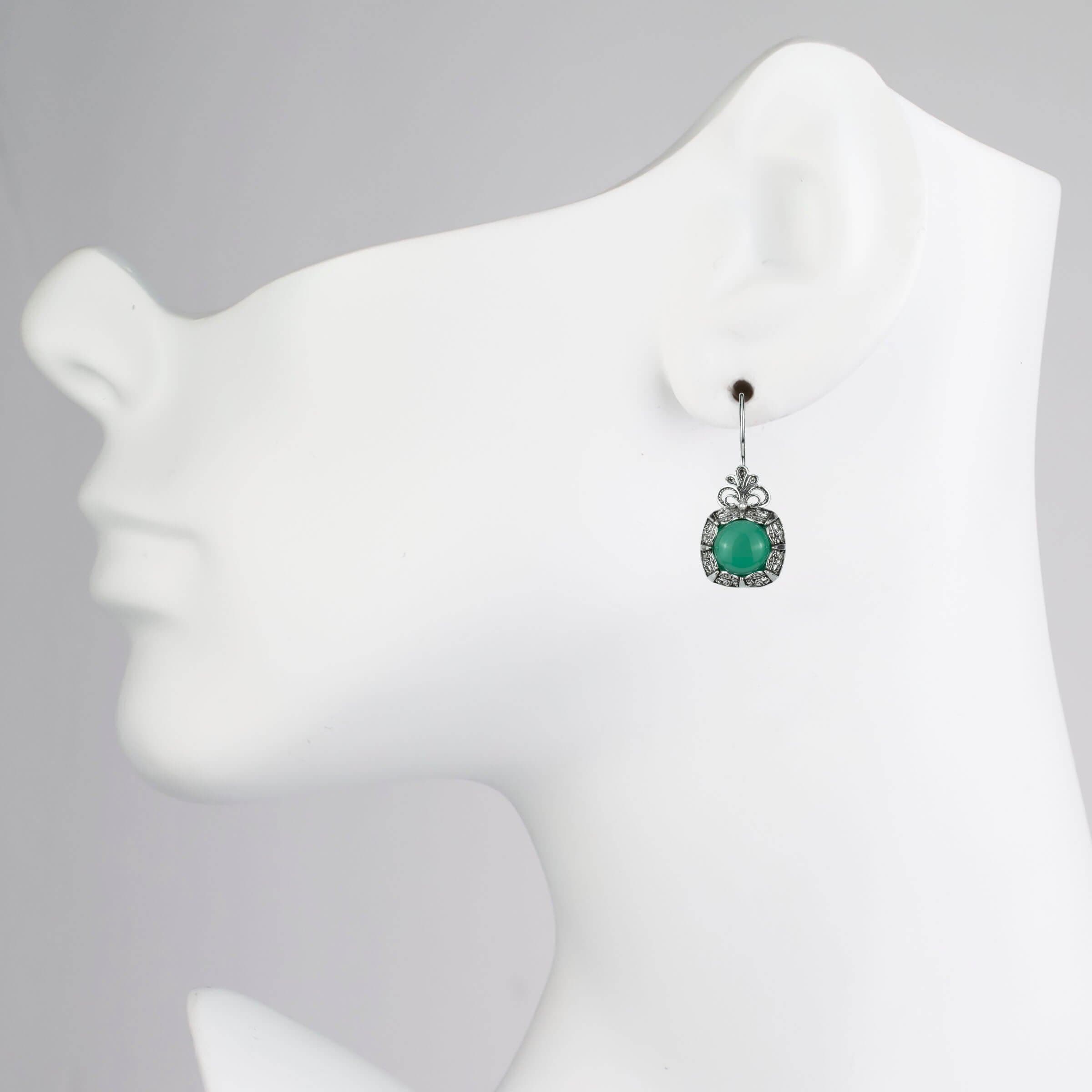 Elegant silver drop earrings featuring intricate filigree design and green agate gemstone, perfect for women.