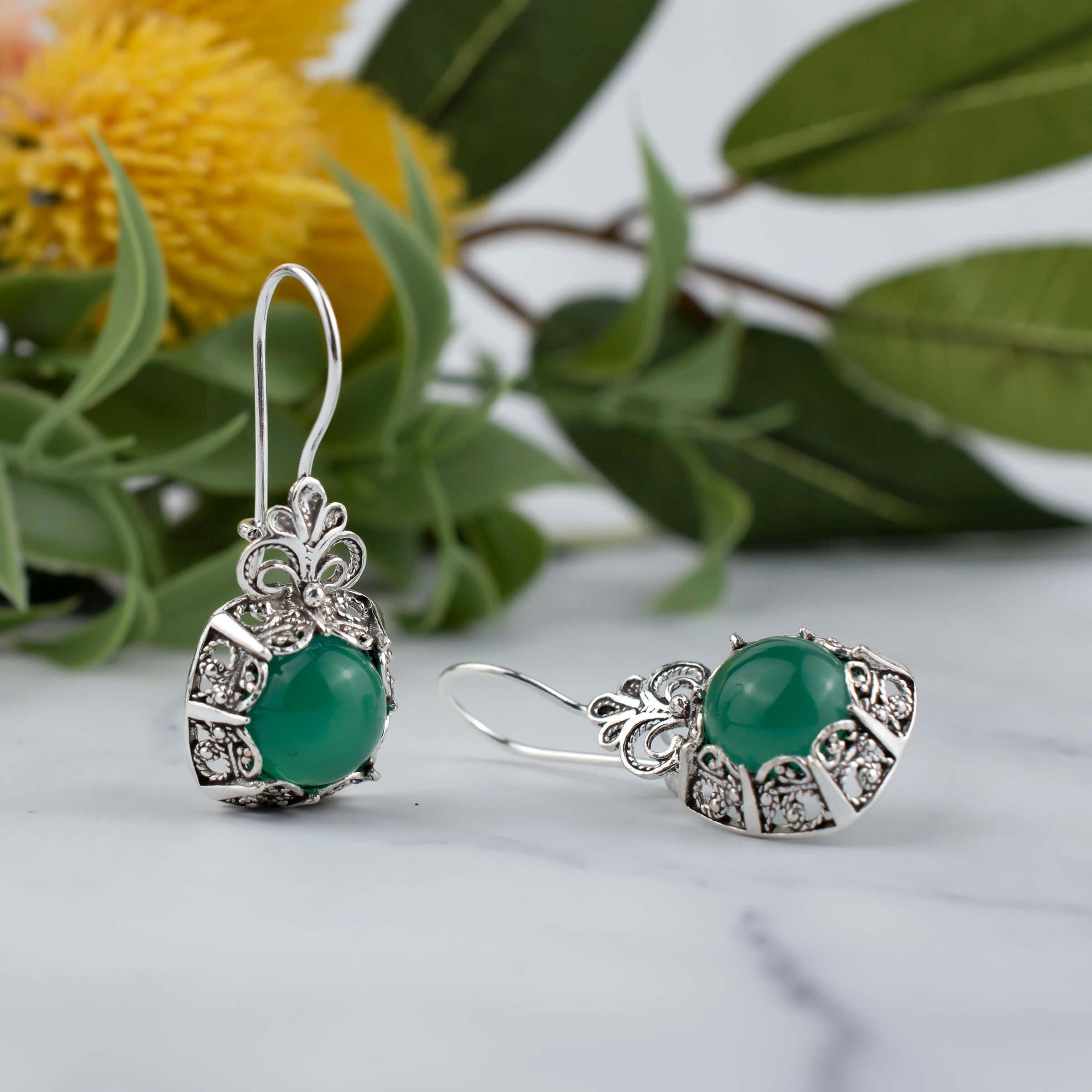 Elegant silver drop earrings featuring intricate filigree design and green agate gemstone, perfect for women.