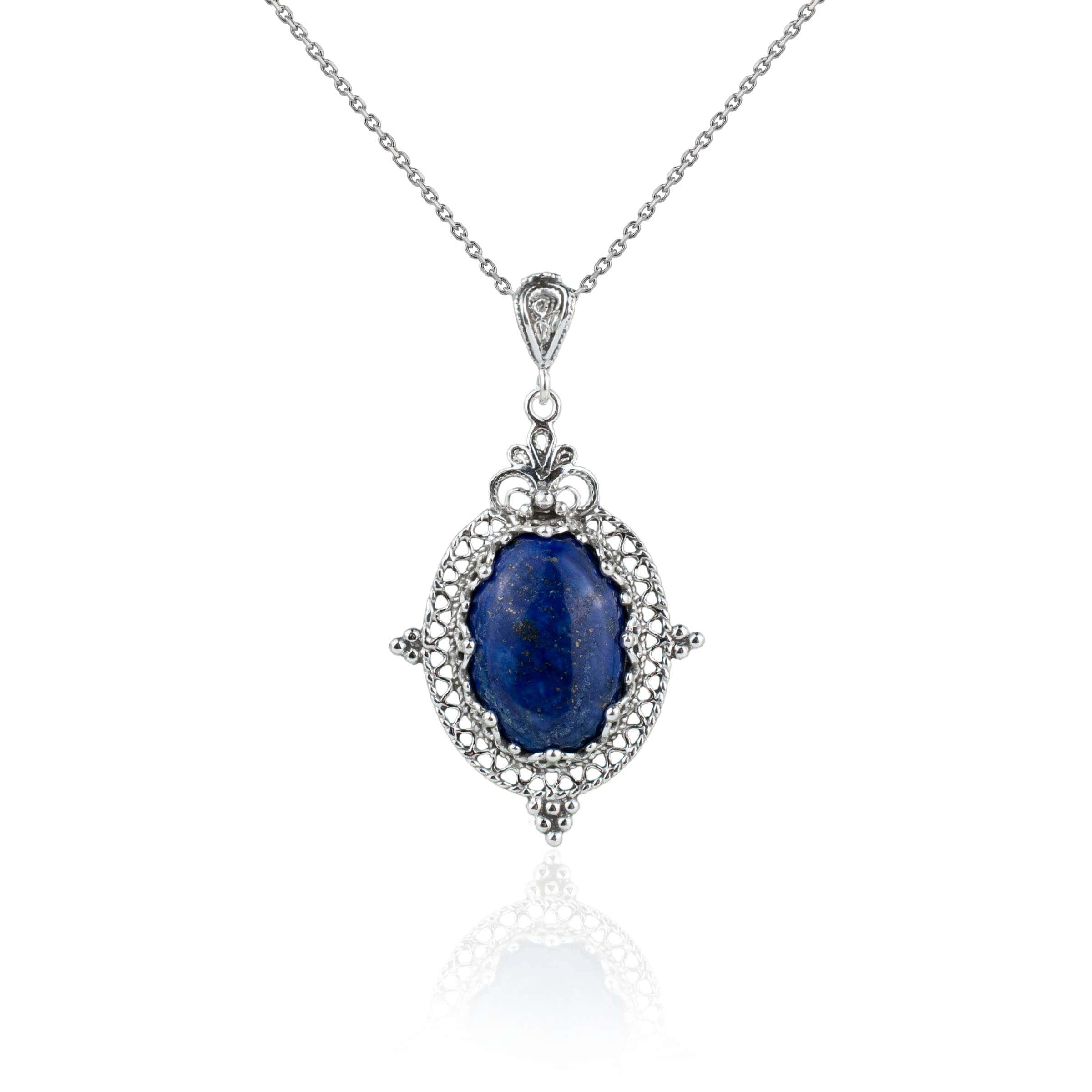 Elegant sterling silver filigree pendant necklace featuring a natural lapis lazuli gemstone in an oval shape.