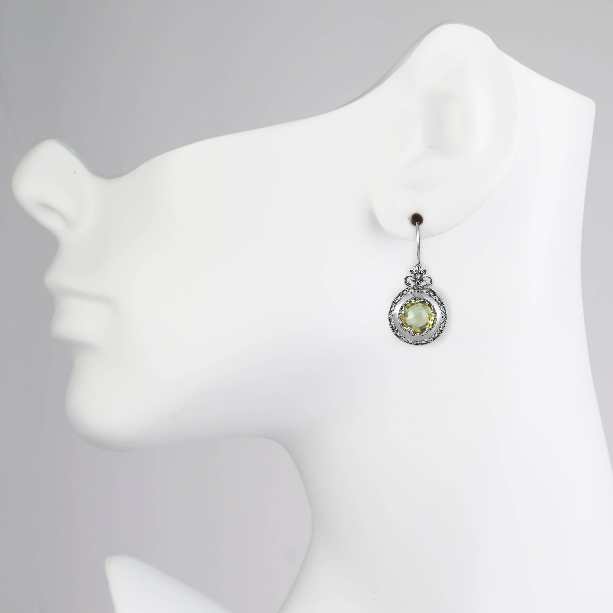 Elegant silver drop earrings featuring intricate filigree art and vibrant lemon quartz gemstones, perfect for women.