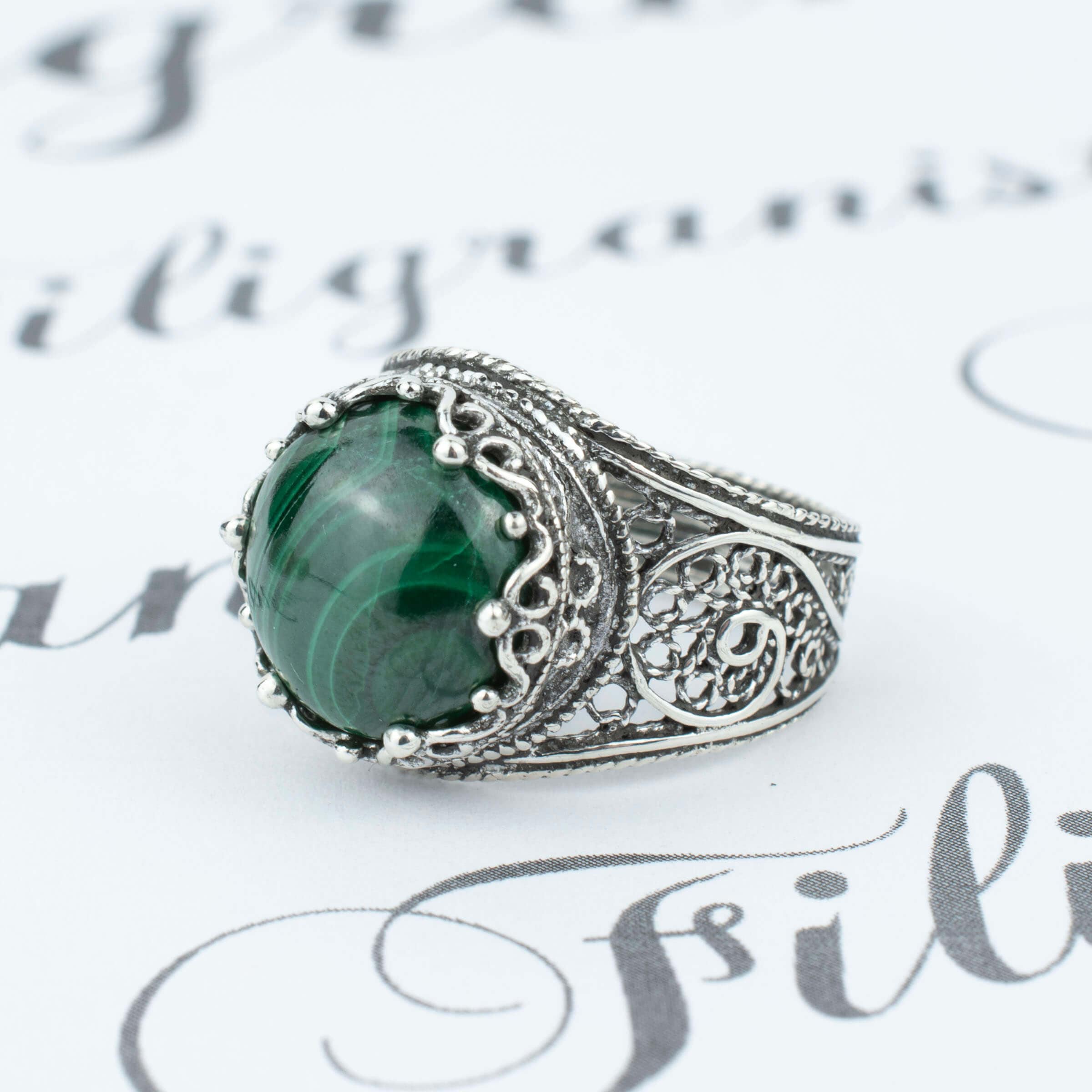 Handmade Filigree Art Malachite Gemstone Crown Design Silver Cocktail Ring featuring intricate filigree work and a vibrant green Malachite gemstone.