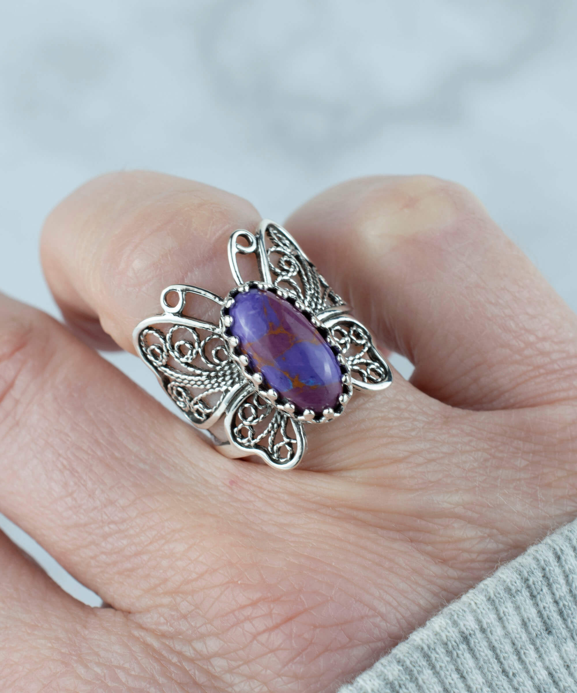 Sterling silver filigree butterfly ring featuring a Mojave turquoise gemstone, elegantly designed for women.