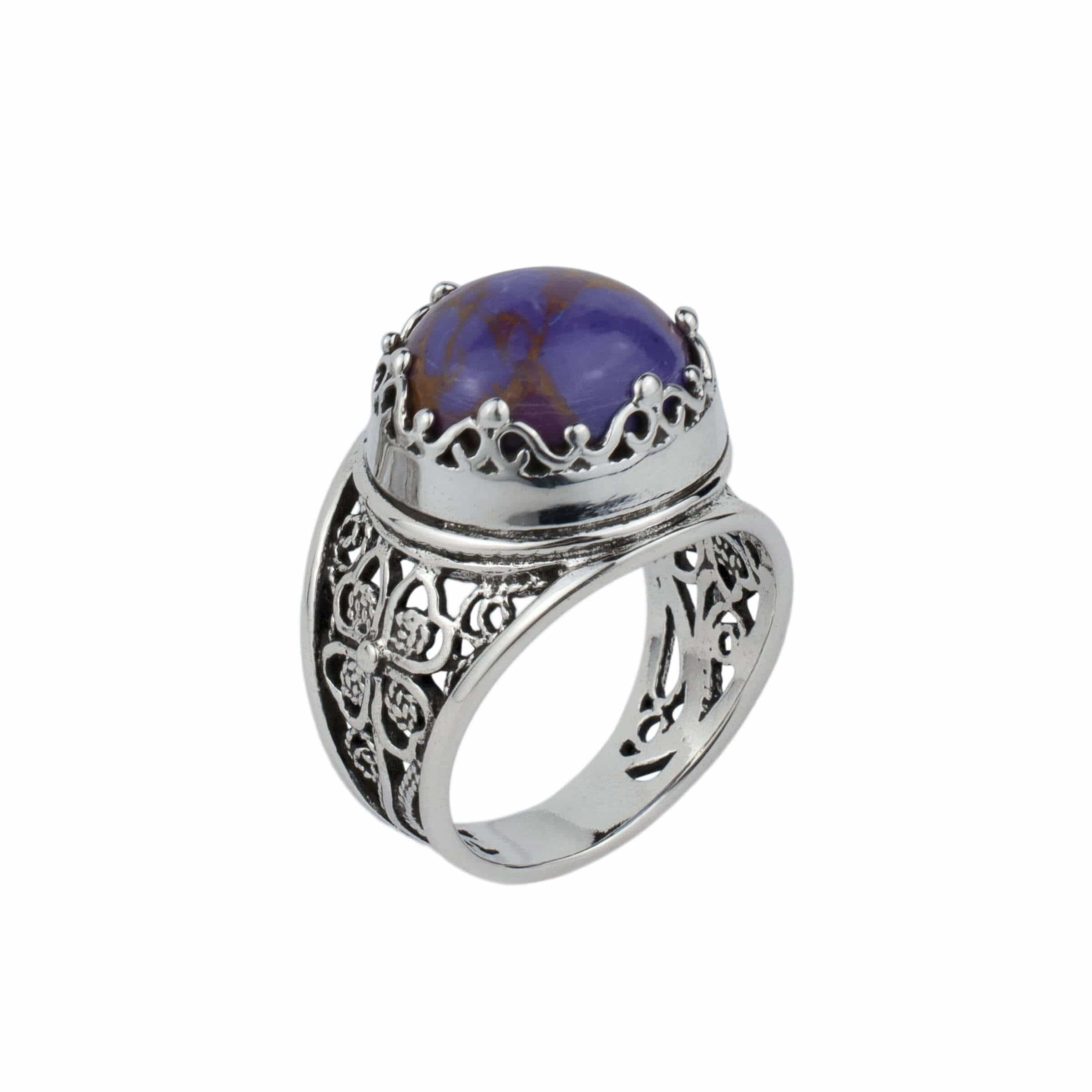 Sterling silver filigree art ring featuring a round rose cut Mojave turquoise gemstone, elegantly designed with intricate metalwork.