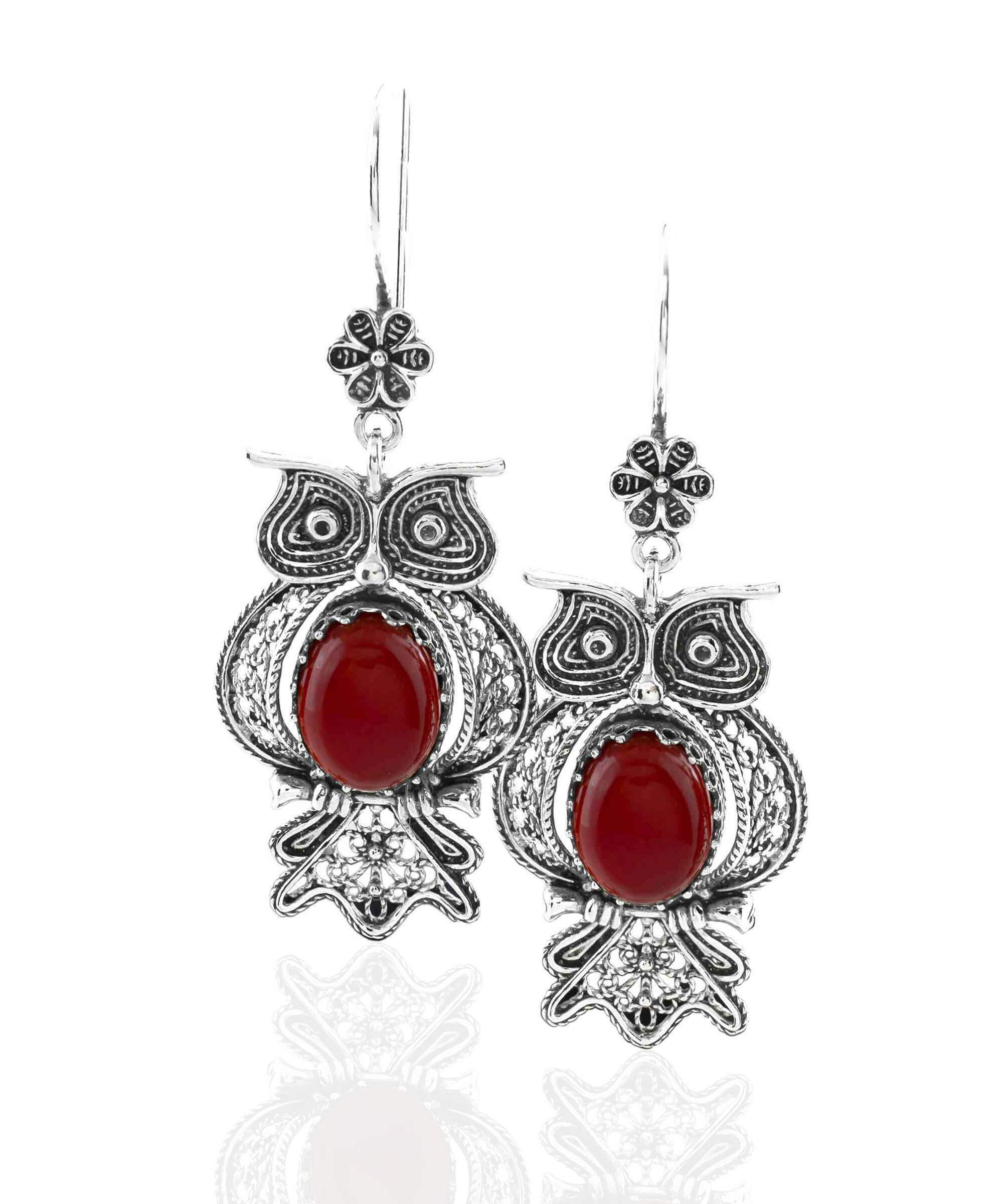 Elegant owl-shaped dangle earrings made of 925 sterling silver with intricate filigree design and a vibrant Carnelian gemstone centerpiece.