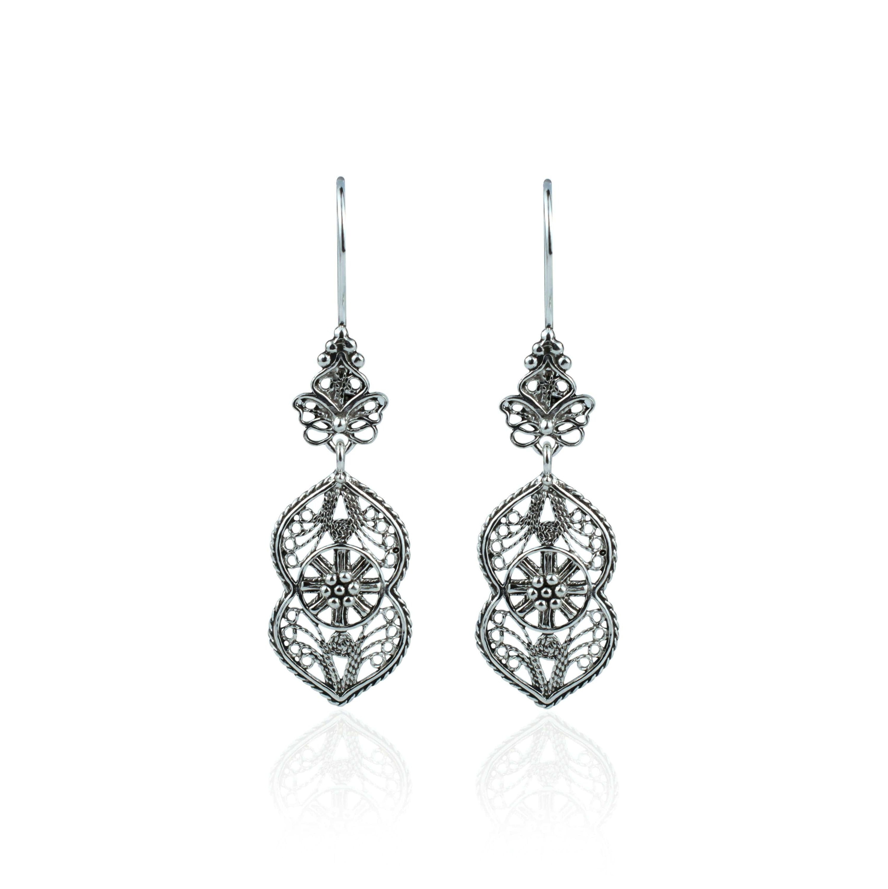 Elegant sterling silver dangle drop earrings featuring intricate paisley filigree design, showcasing a vintage look and polished shine.