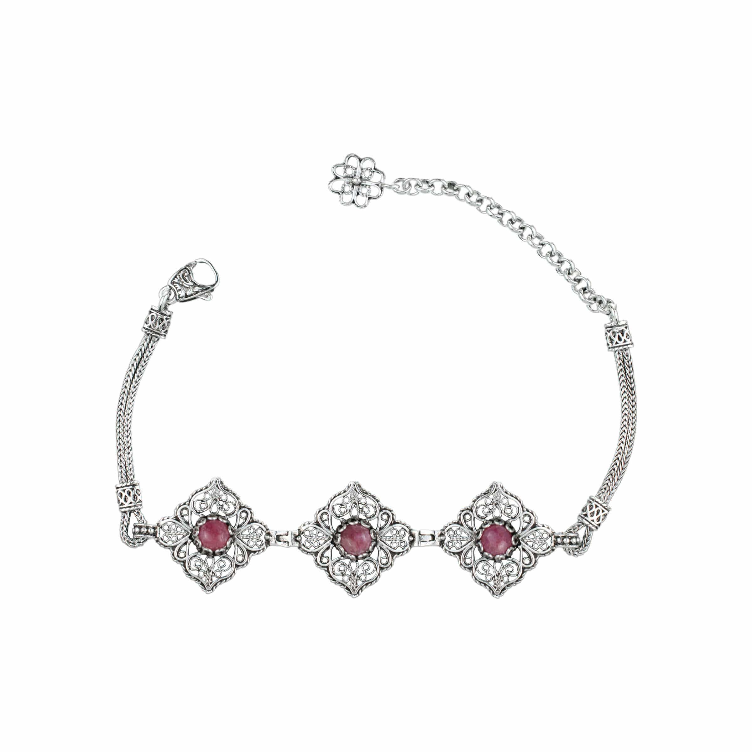 Elegant adjustable silver link bracelet featuring filigree art and a natural rhodonite gemstone, beautifully crafted for women.