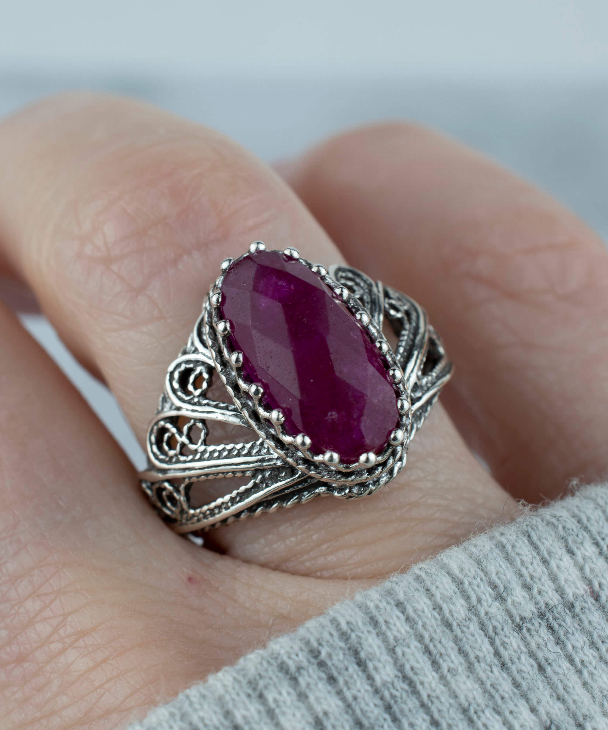 Filigree Art Ruby Corundum Gemstone Angel Design ring in 925 sterling silver, showcasing intricate angel motifs and a vibrant ruby gemstone.