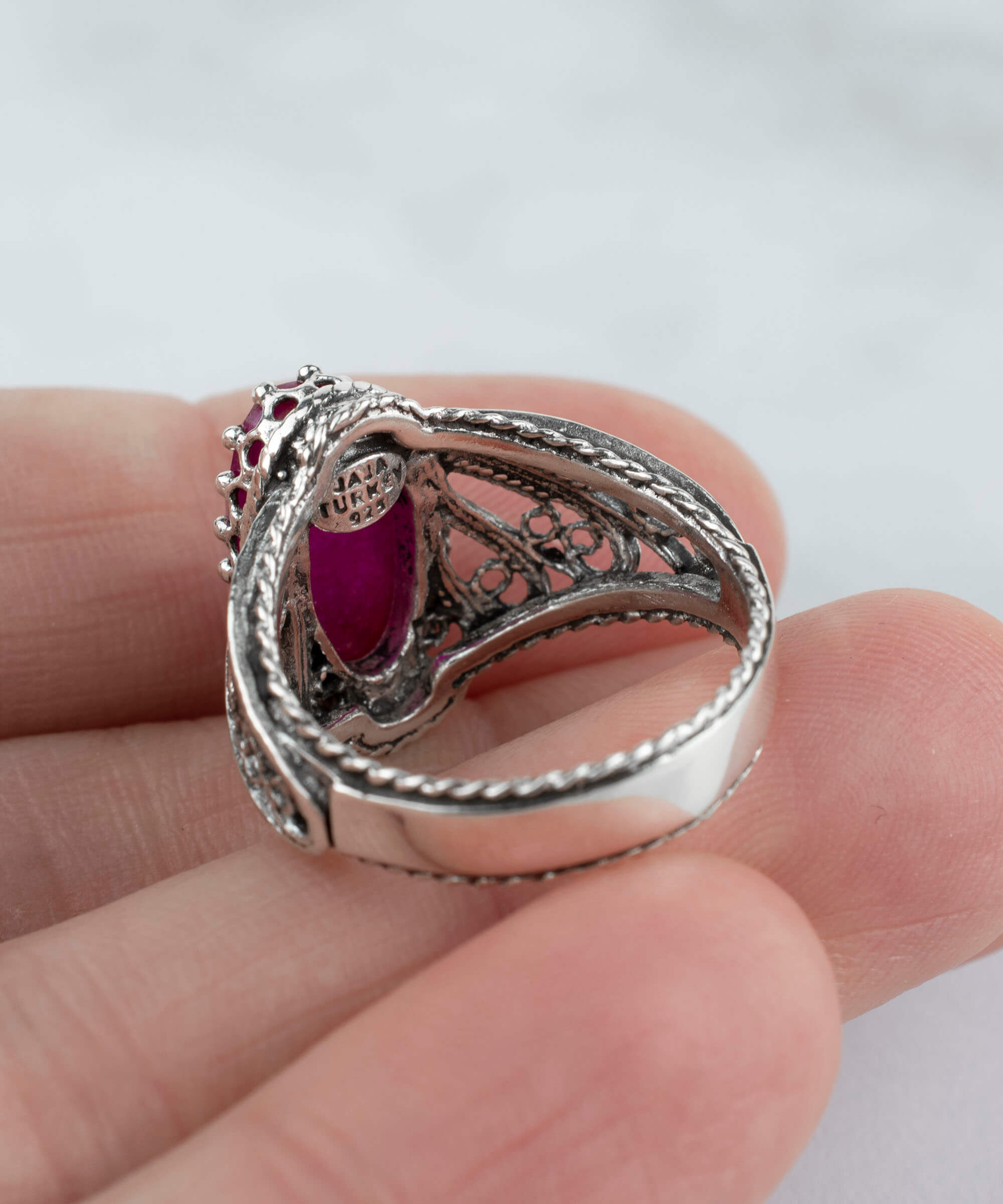 Filigree Art Ruby Corundum Gemstone Angel Design ring in 925 sterling silver, showcasing intricate angel motifs and a vibrant ruby gemstone.