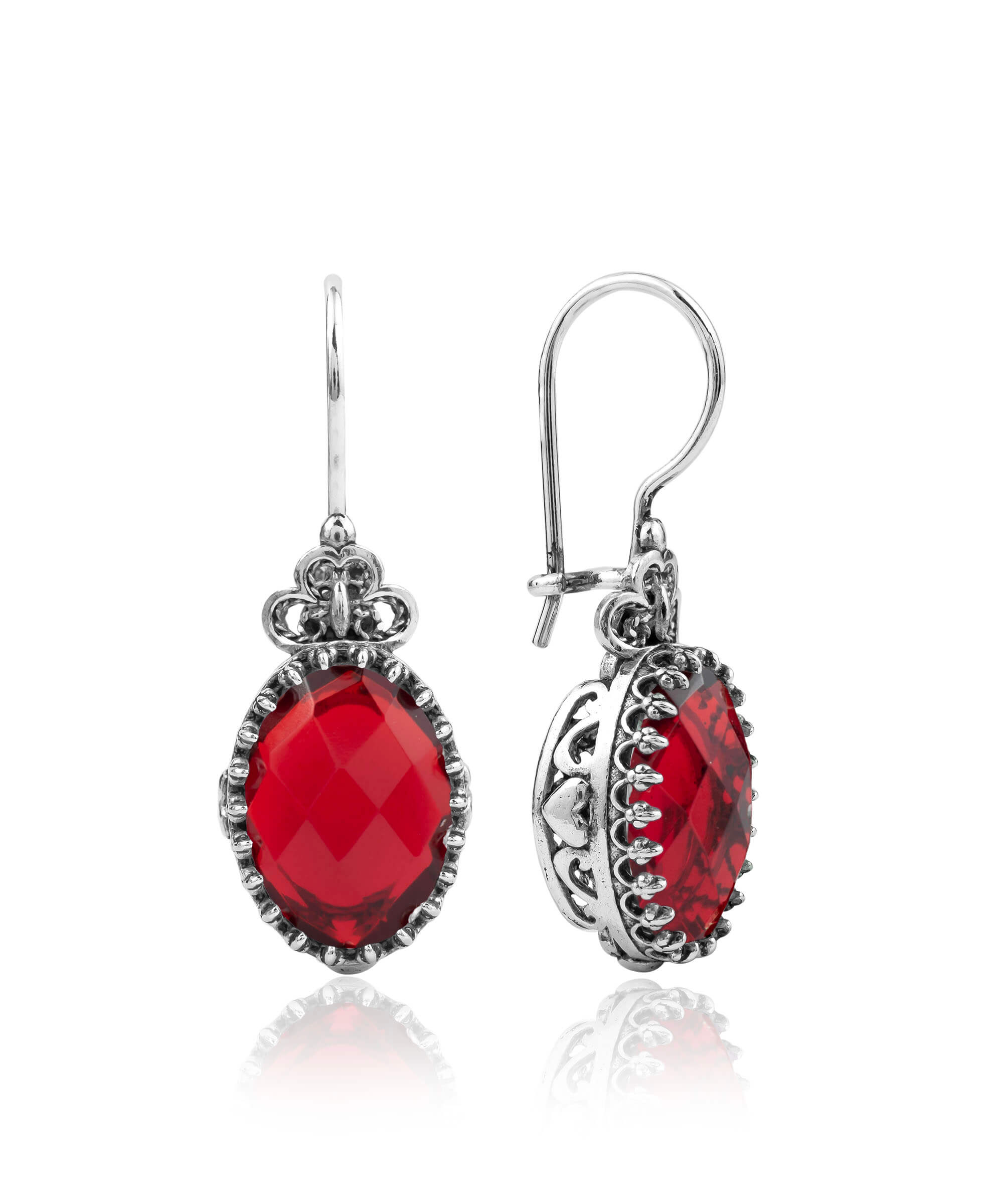 Elegant silver earrings featuring intricate filigree art and a vibrant Ruby Quartz gemstone in a heart design.