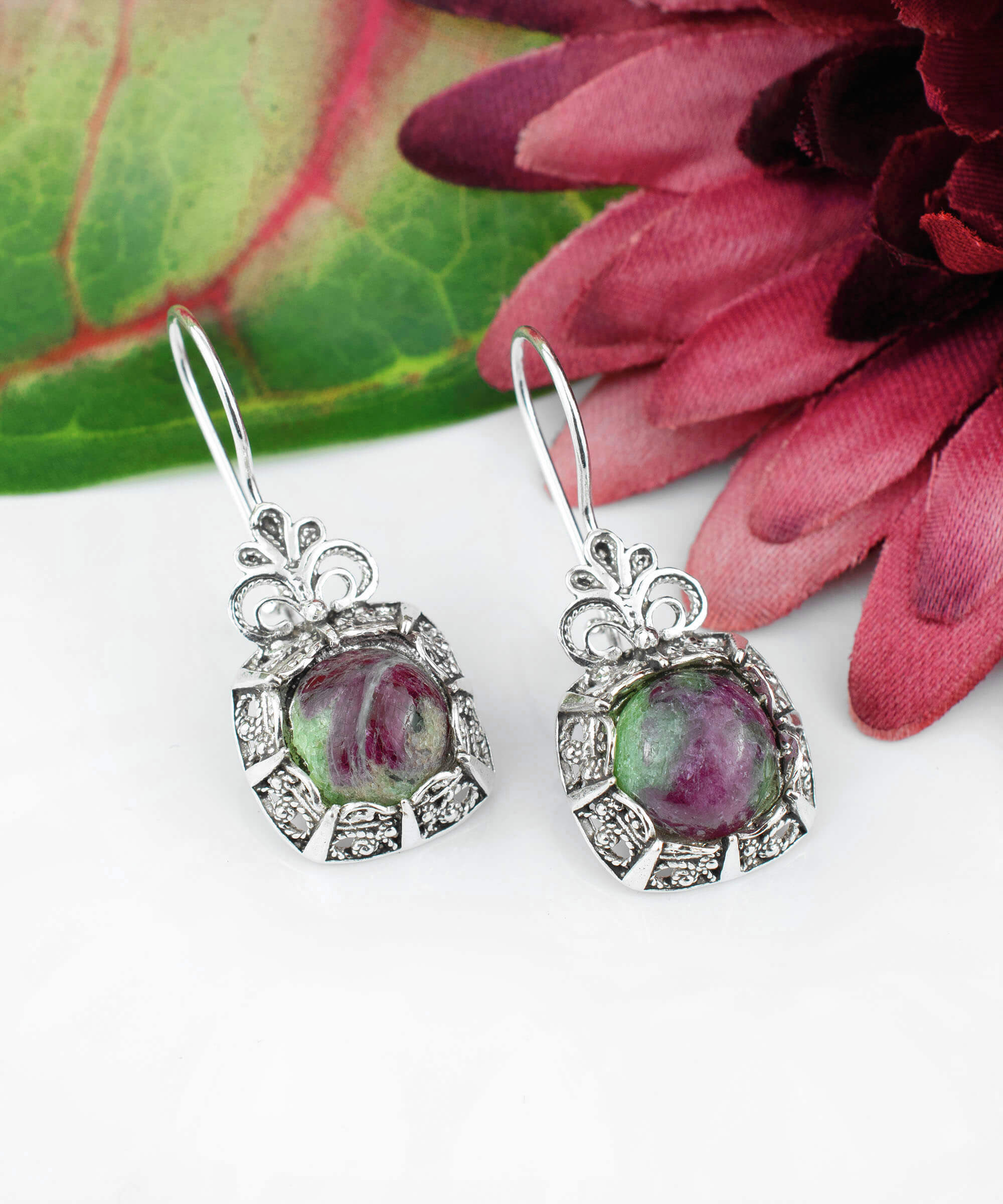 Elegant silver drop earrings featuring intricate filigree work and vibrant ruby zoisite gemstones, perfect for women.