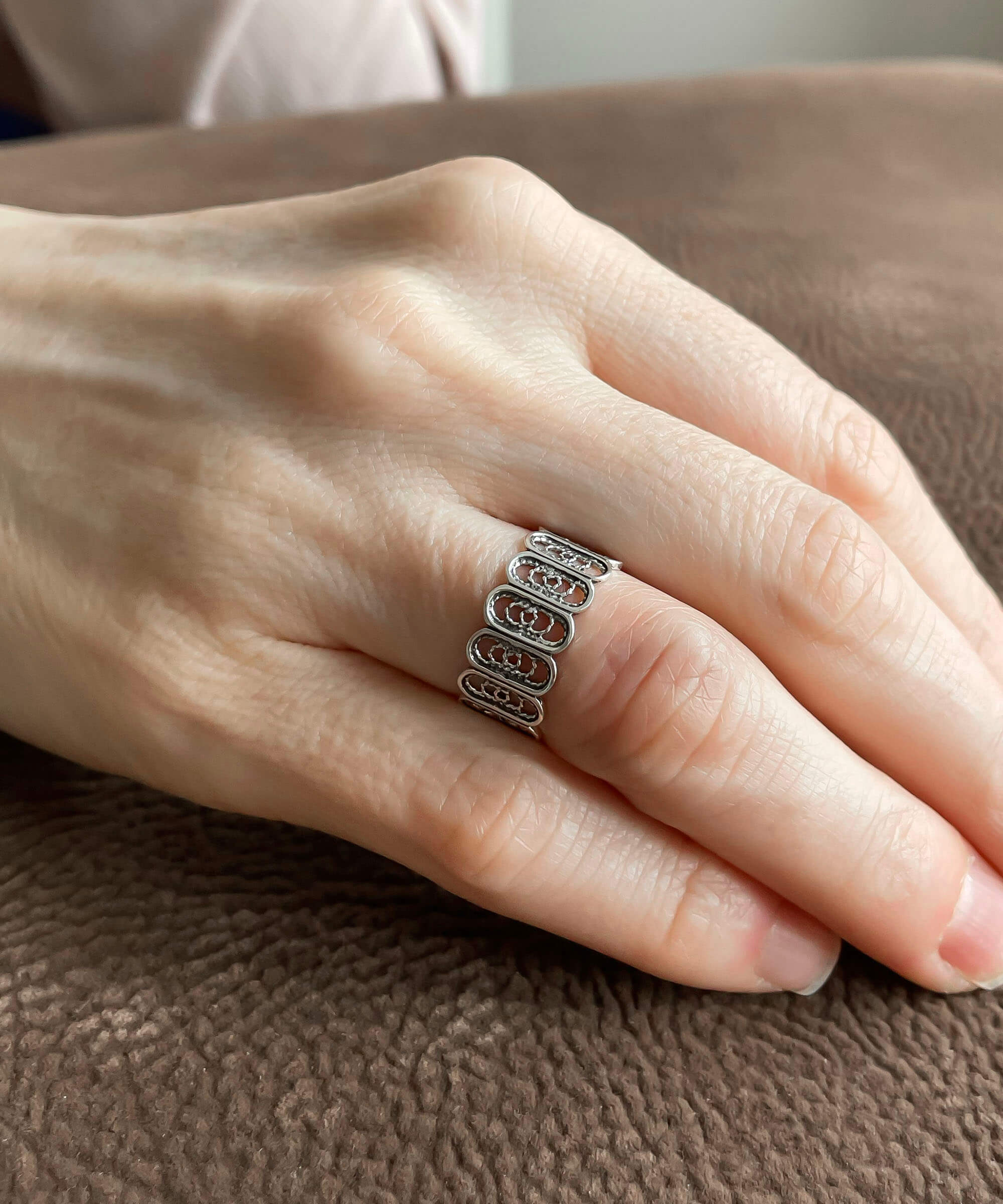 Elegant Filigree Art Sterling Silver Band Ring with oval design, showcasing intricate metal strands and a polished finish.