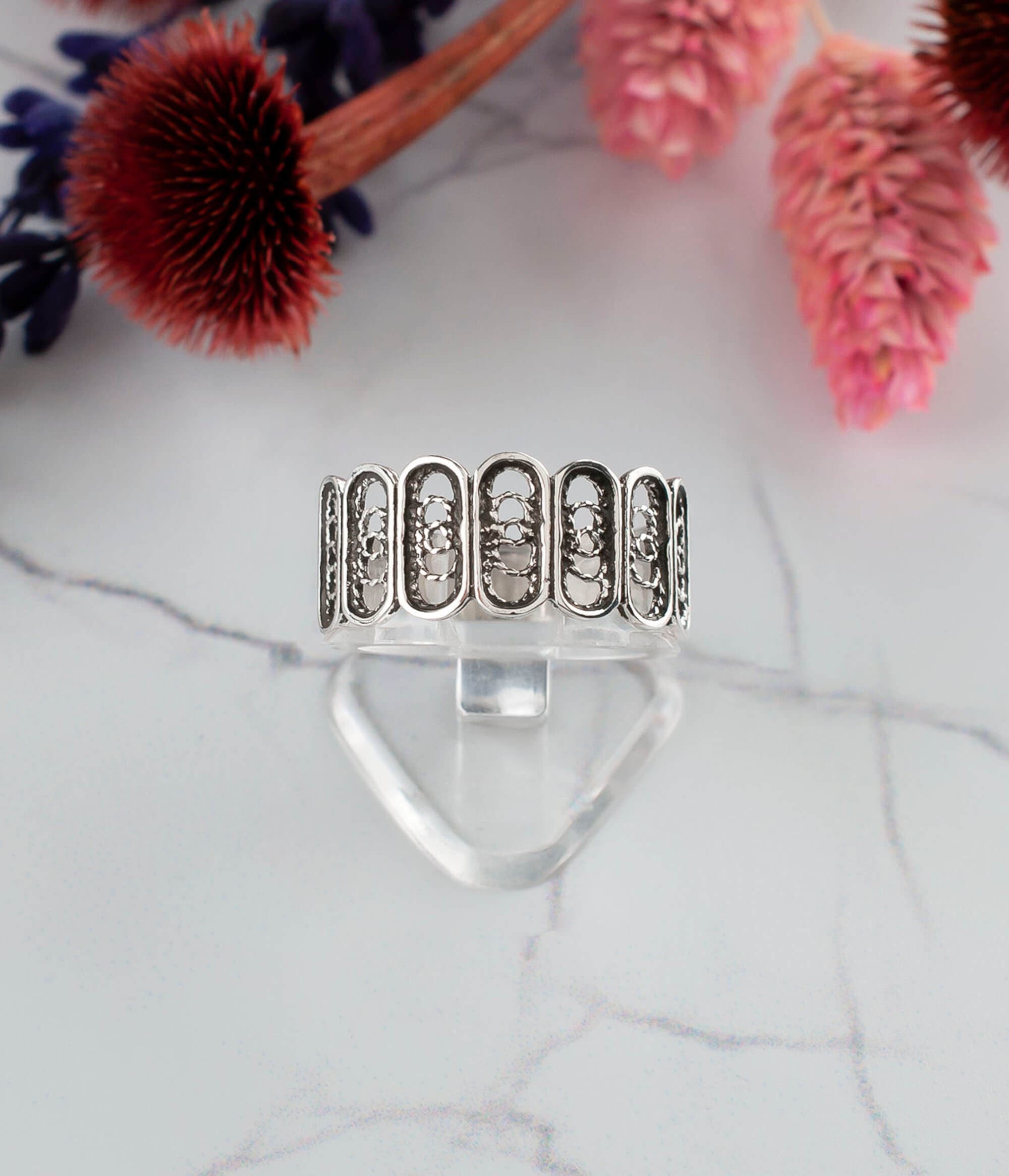 Elegant Filigree Art Sterling Silver Band Ring with oval design, showcasing intricate metal strands and a polished finish.