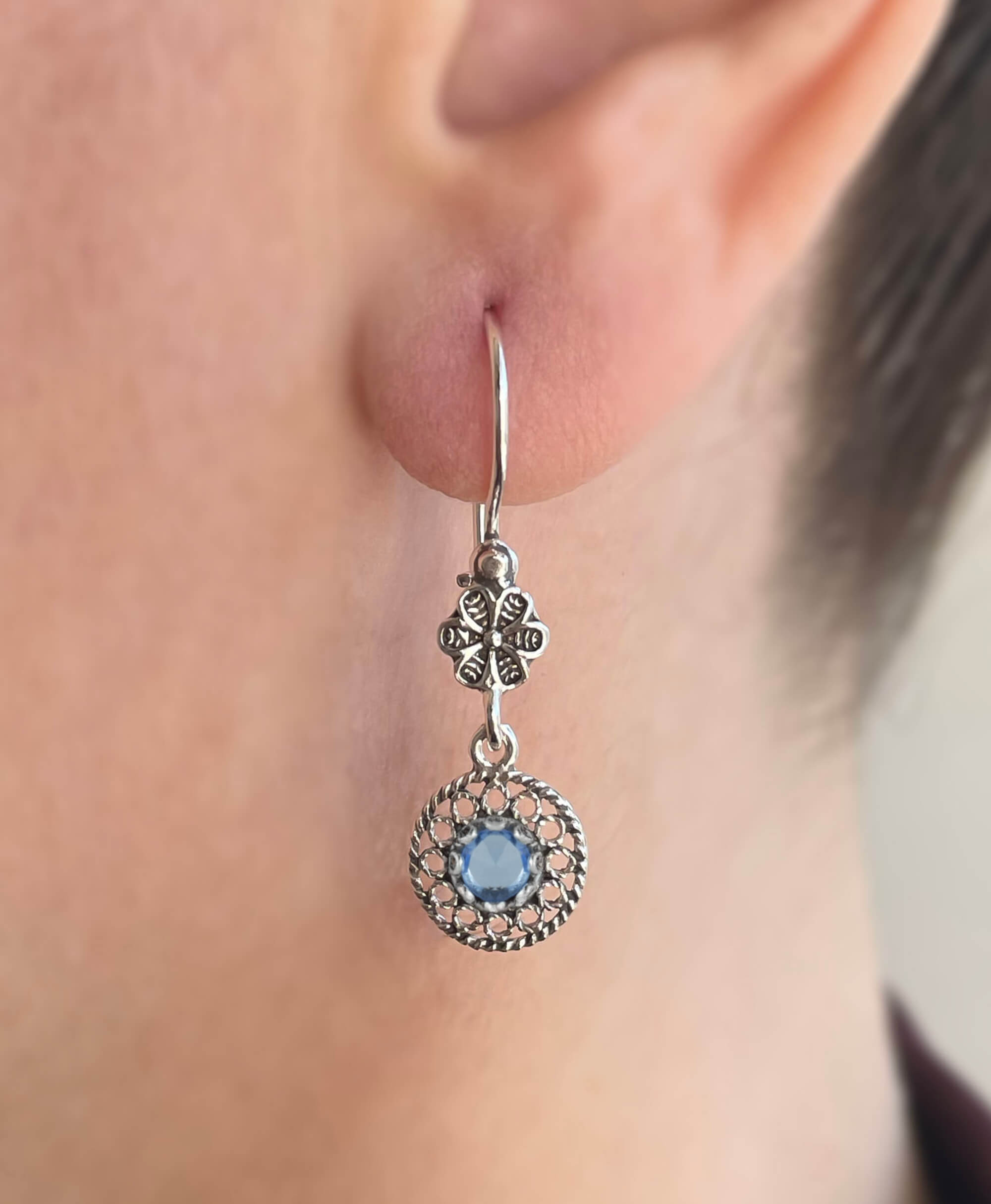 Elegant silver dangle earrings featuring sun-shaped filigree design with colorful gemstones including Amethyst, Blue Topaz, Blue Quartz, and Citrine.