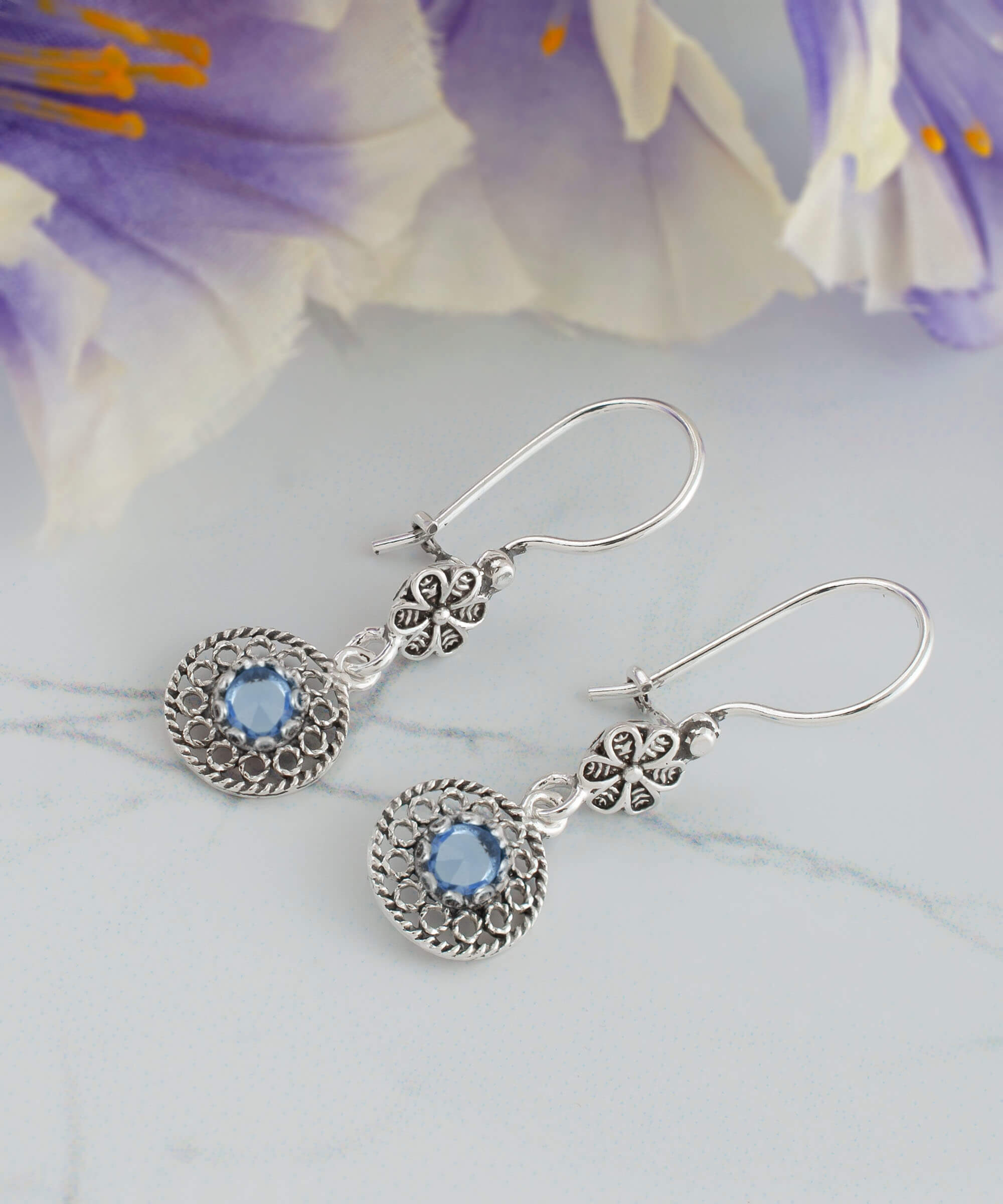 Elegant silver dangle earrings featuring sun-shaped filigree design with colorful gemstones including Amethyst, Blue Topaz, Blue Quartz, and Citrine.