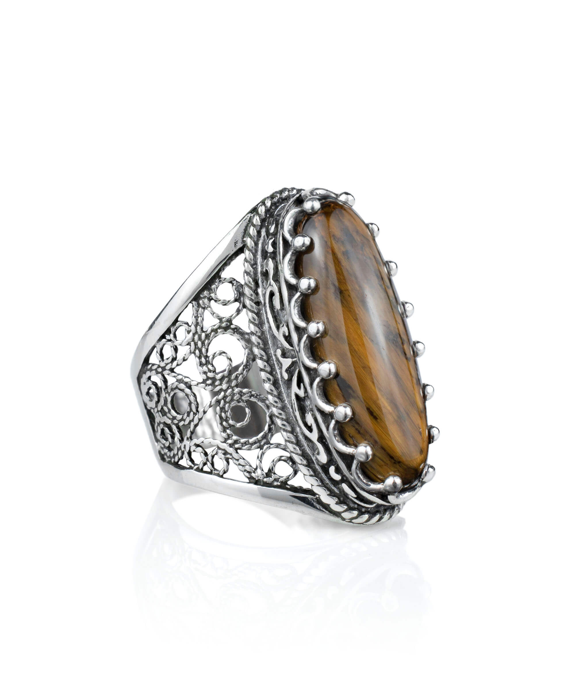 Elegant 925 sterling silver long statement ring featuring intricate filigree design and an oval-cut tiger eye gemstone.