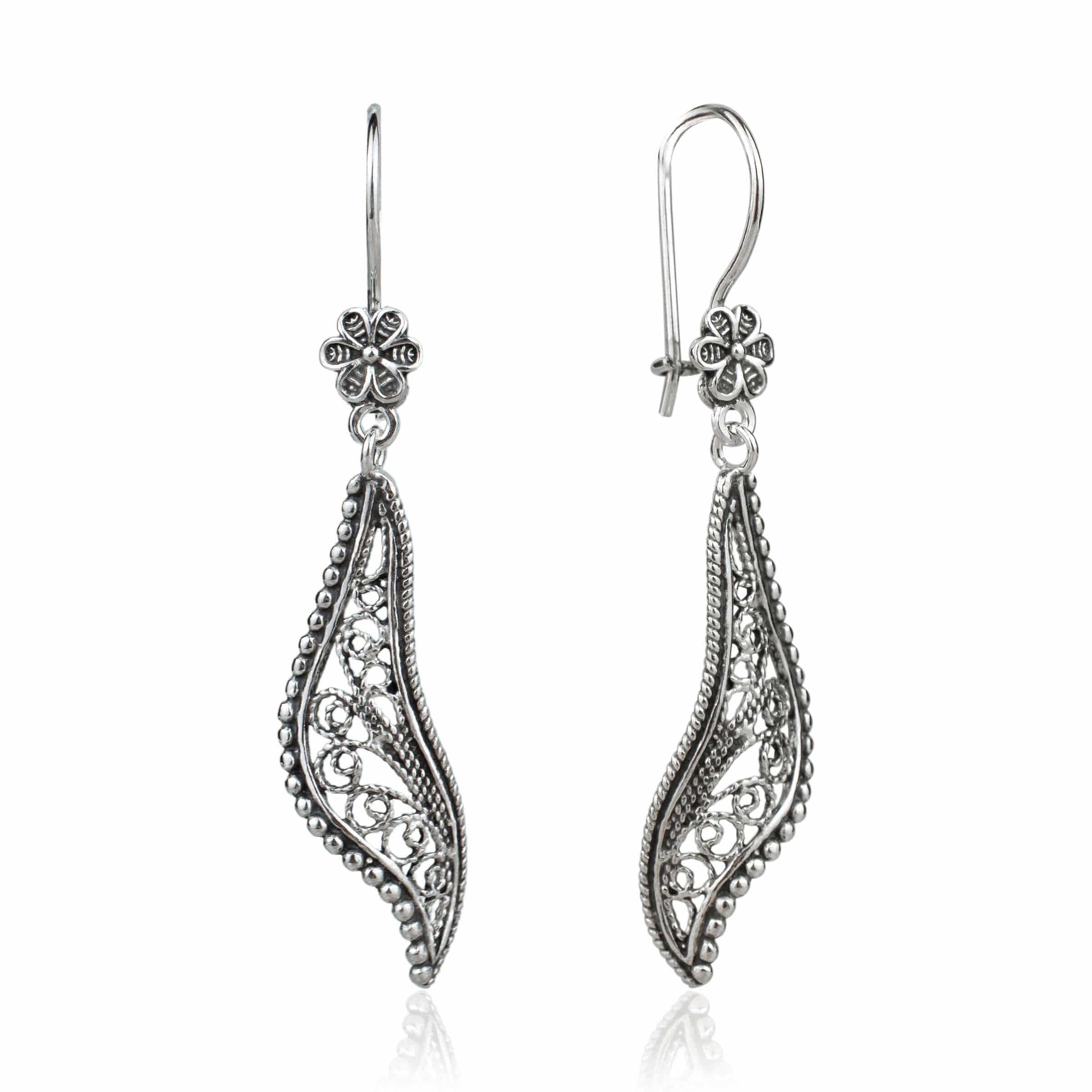 Elegant handmade sterling silver dangle drop earrings featuring a twisted design and intricate filigree detailing.