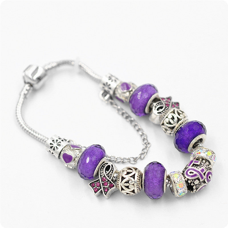 Filigree Crystal Pav'e Purple Awareness Charm Bracelet featuring 14K white gold plating, purple awareness pendants, and sparkling white crystals.