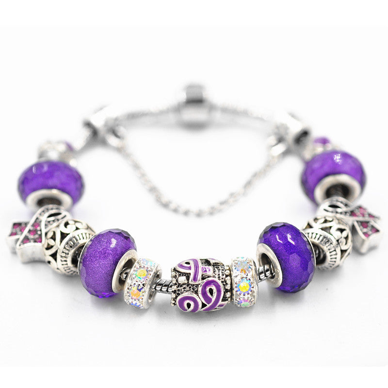 Filigree Crystal Pav'e Purple Awareness Charm Bracelet featuring 14K white gold plating, purple awareness pendants, and sparkling white crystals.