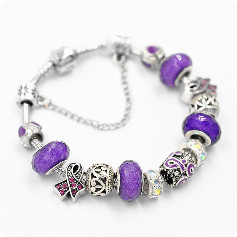 Filigree Crystal Pav'e Purple Awareness Charm Bracelet featuring 14K white gold plating, purple awareness pendants, and sparkling white crystals.