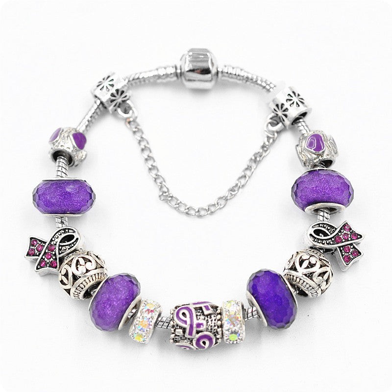 Filigree Crystal Pav'e Purple Awareness Charm Bracelet featuring 14K white gold plating, purple awareness pendants, and sparkling white crystals.