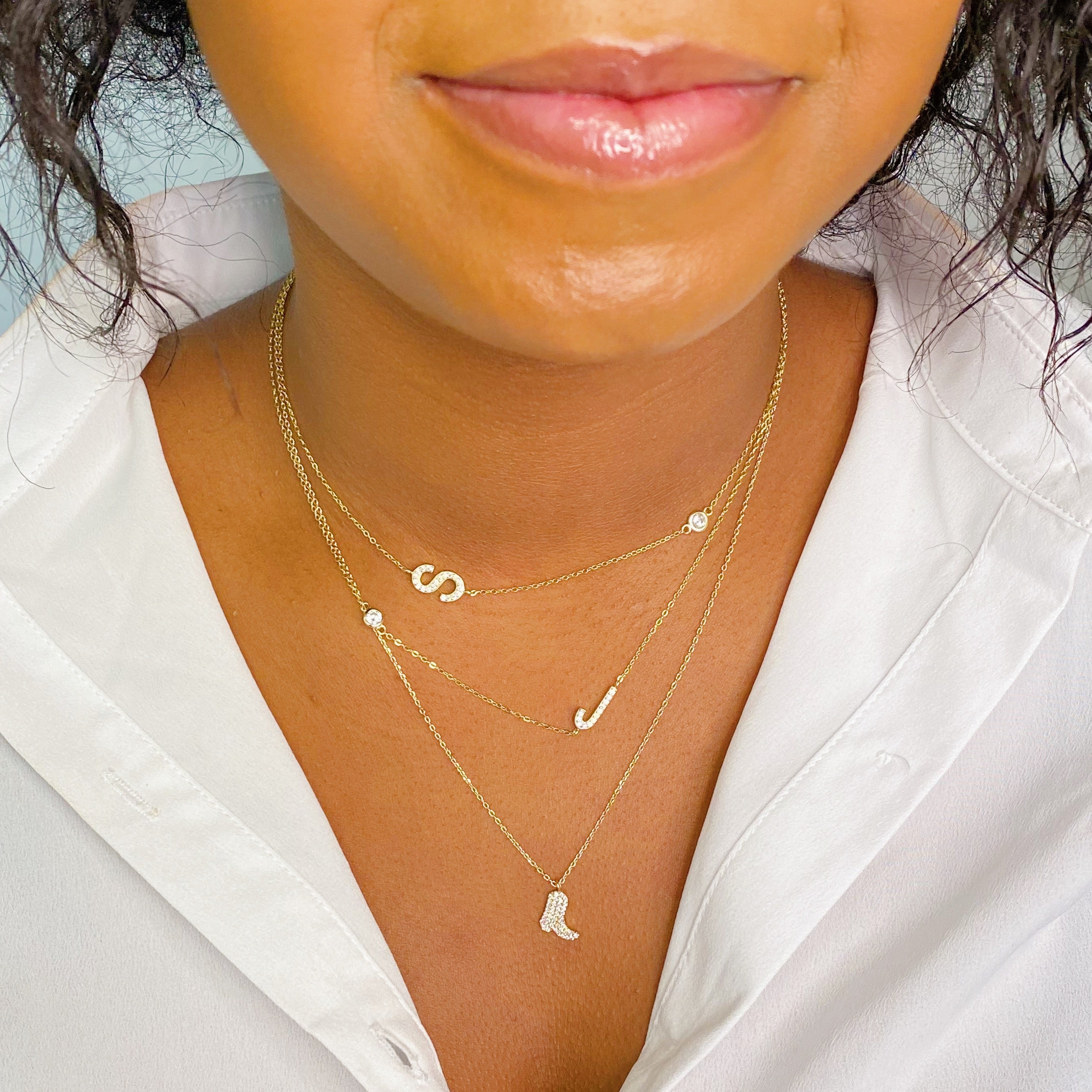 Finest Shine Initial Sterling Silver Necklace featuring a dainty chain, side hanging initial charm, and small cubic zirconia for added sparkle.