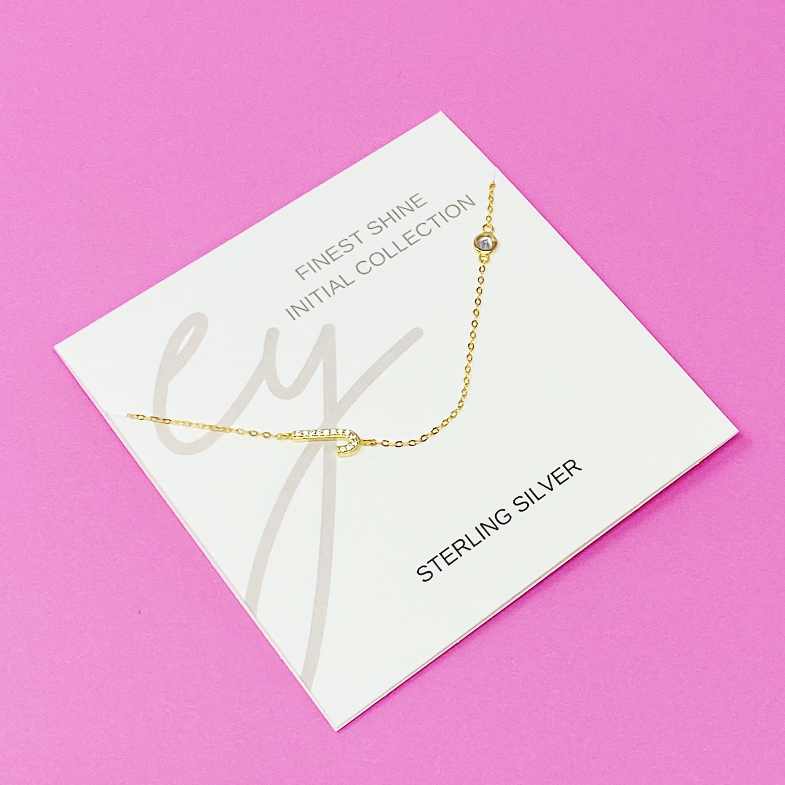 Finest Shine Initial Sterling Silver Necklace featuring a dainty chain, side hanging initial charm, and small cubic zirconia for added sparkle.