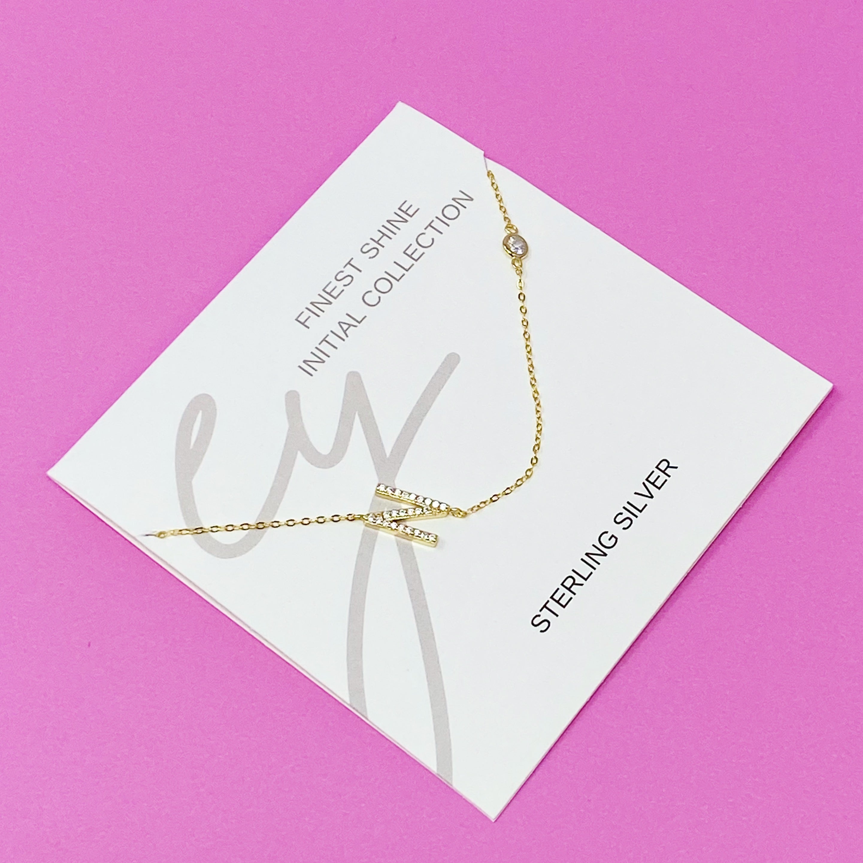 Finest Shine Initial Sterling Silver Necklace featuring a dainty chain, side hanging initial charm, and small cubic zirconia for added sparkle.