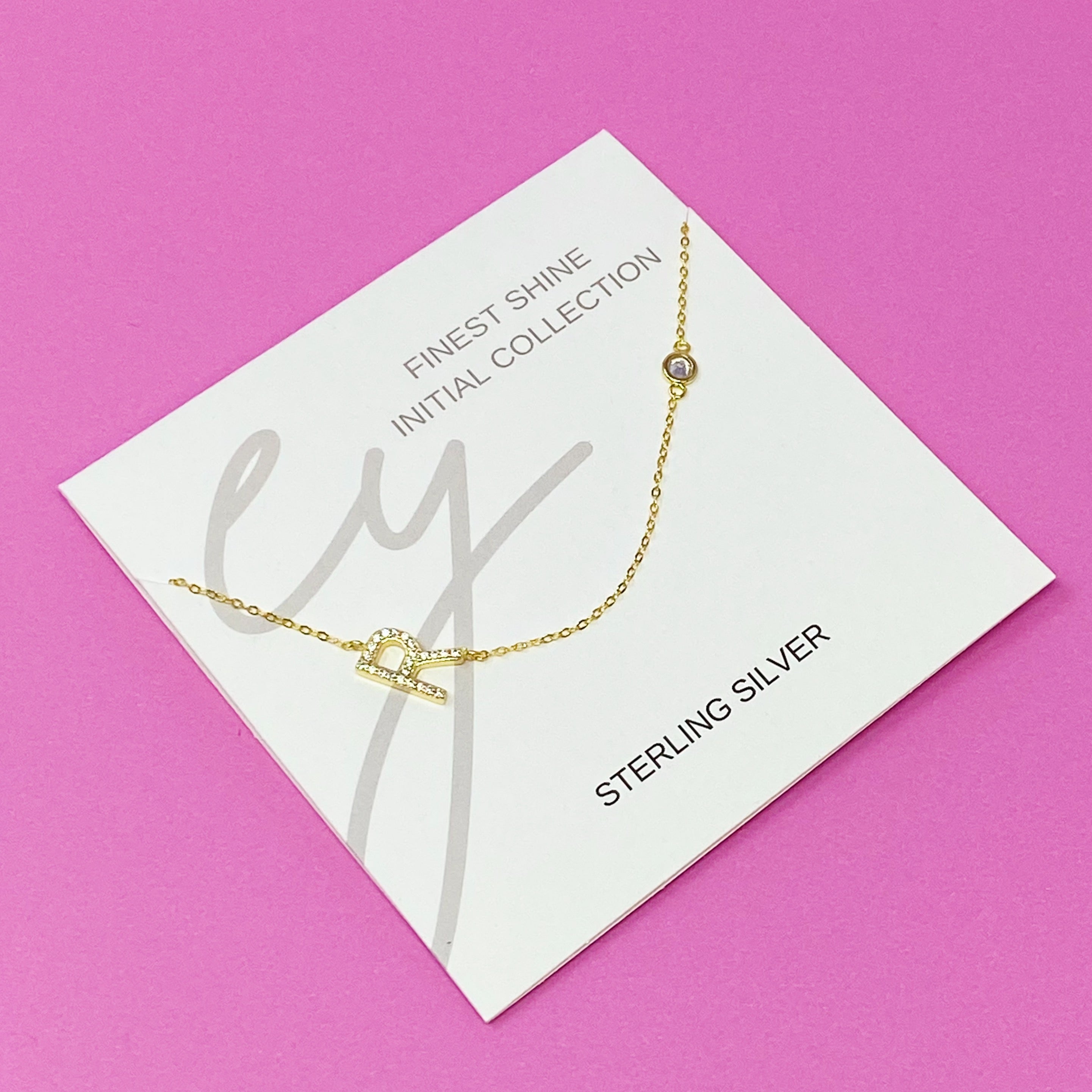 Finest Shine Initial Sterling Silver Necklace featuring a dainty chain, side hanging initial charm, and small cubic zirconia for added sparkle.