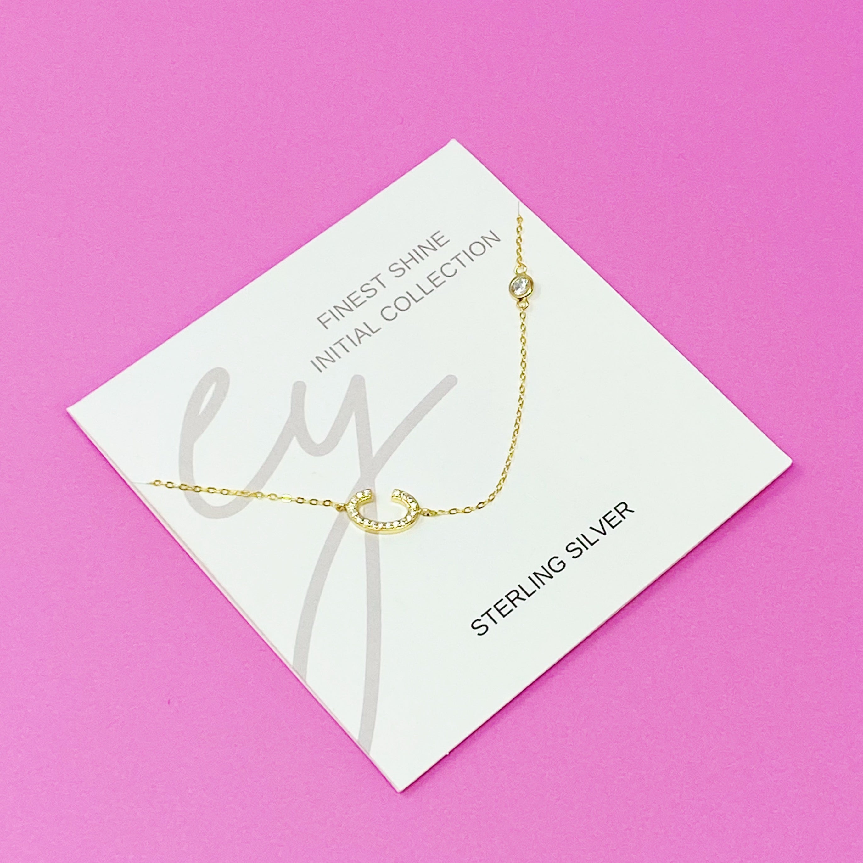 Finest Shine Initial Sterling Silver Necklace featuring a dainty chain, side hanging initial charm, and small cubic zirconia for added sparkle.