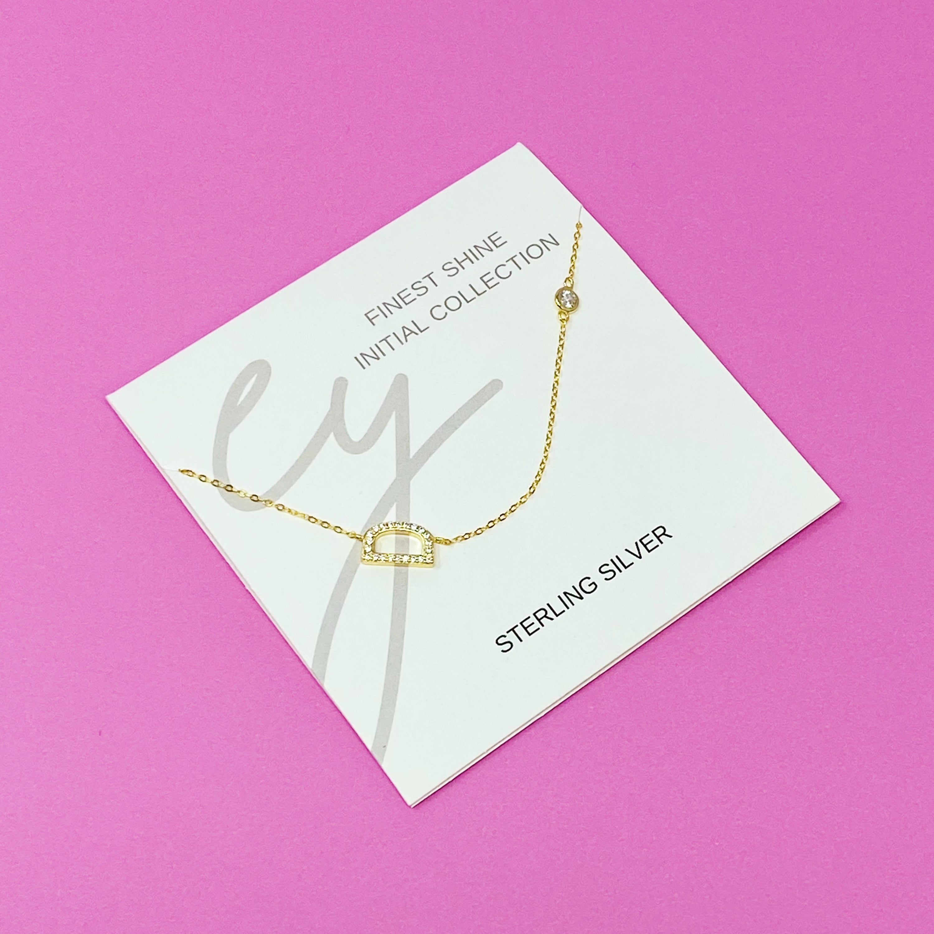 Finest Shine Initial Sterling Silver Necklace featuring a dainty chain, side hanging initial charm, and small cubic zirconia for added sparkle.