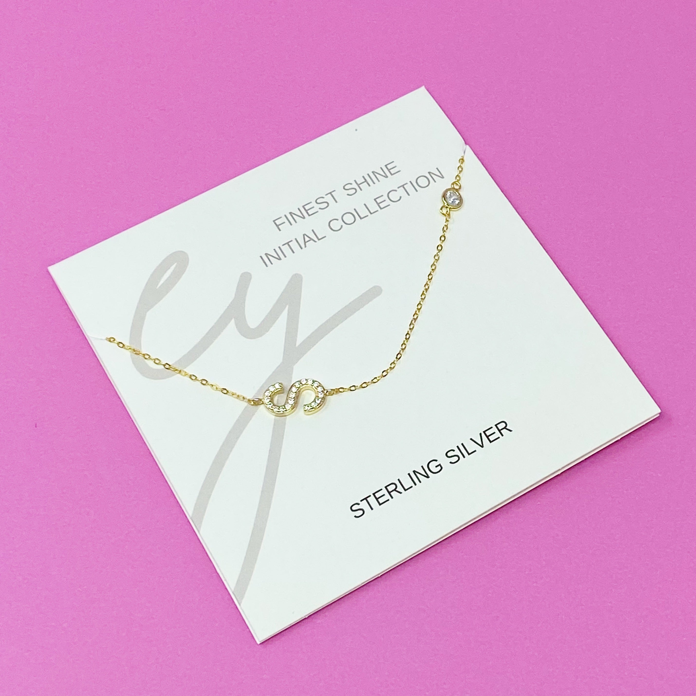 Finest Shine Initial Sterling Silver Necklace featuring a dainty chain, side hanging initial charm, and small cubic zirconia for added sparkle.