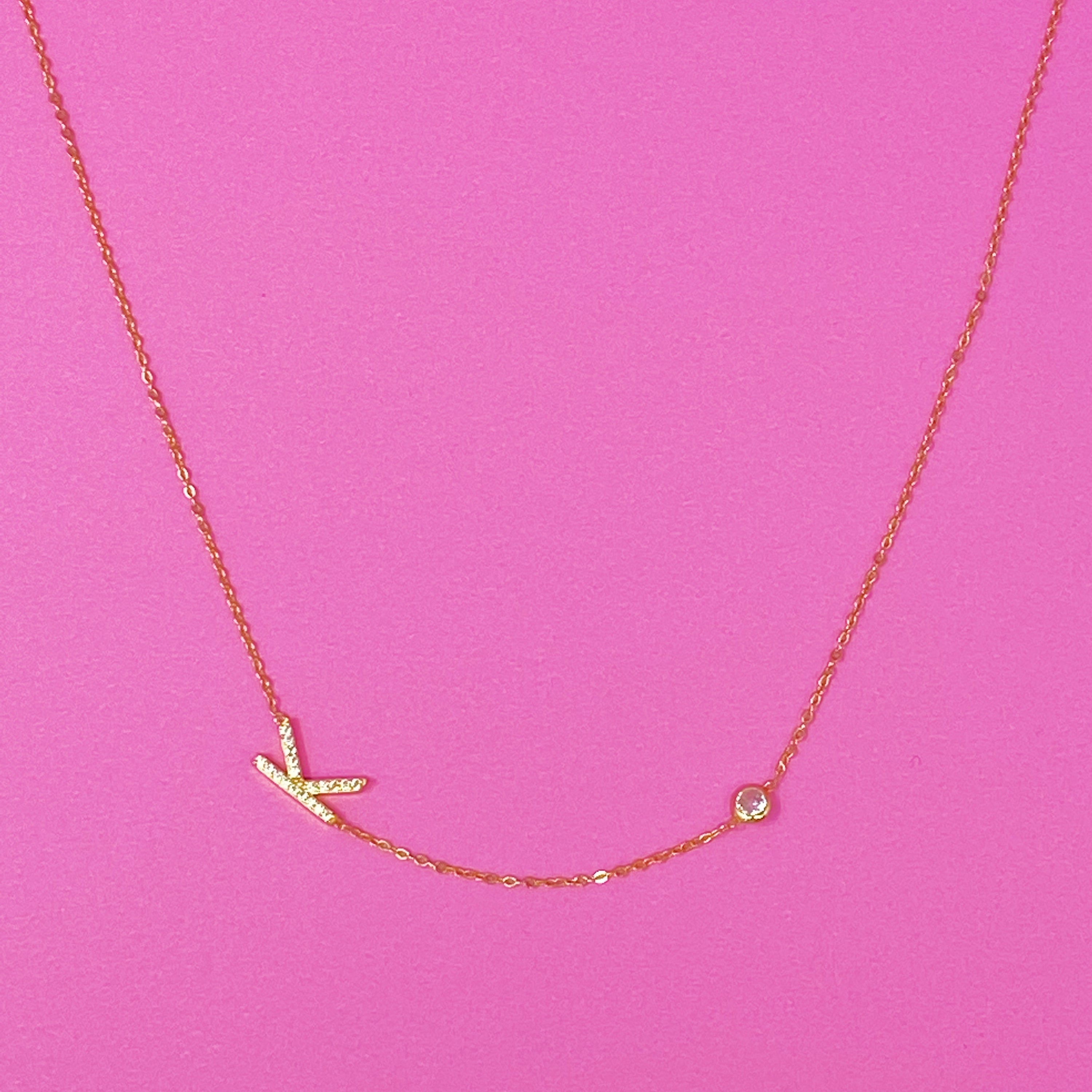 Finest Shine Initial Sterling Silver Necklace featuring a dainty chain, side hanging initial charm, and small cubic zirconia for added sparkle.