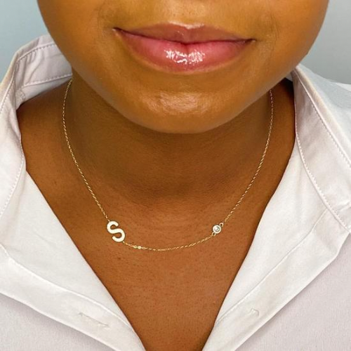 Finest Shine Initial Sterling Silver Necklace featuring a dainty chain, side hanging initial charm, and small cubic zirconia for added sparkle.