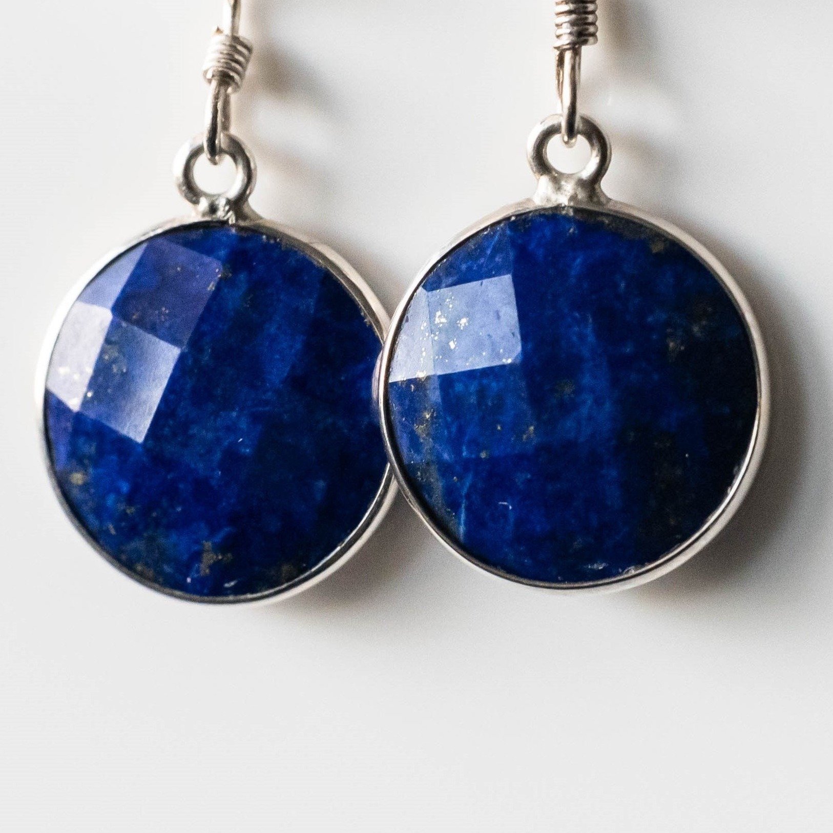 Fiorela Lapis Lazuli Round Drop Earrings in sterling silver, featuring 14 mm blue lapis lazuli stones and anti-tarnish ear wires.