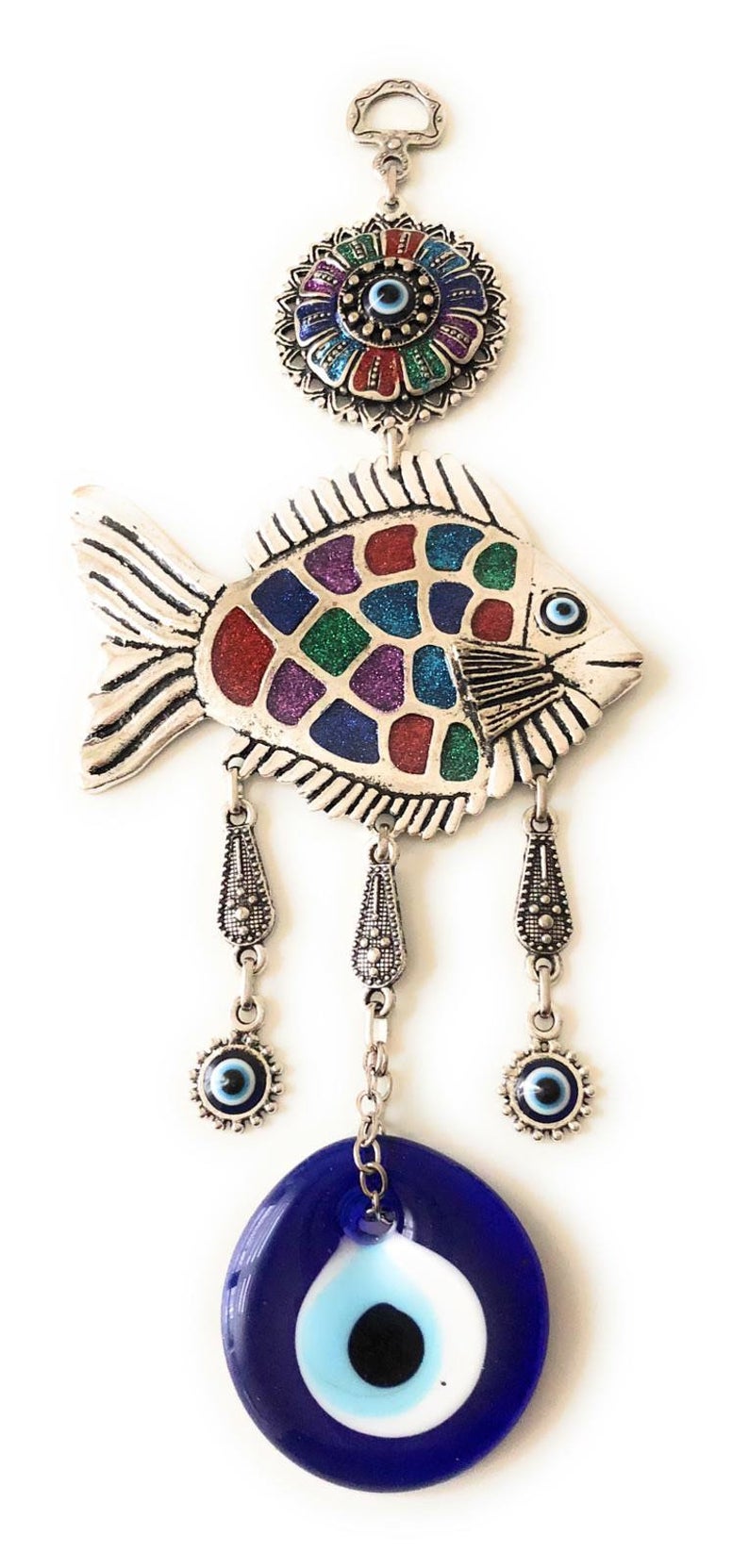 A decorative fish wall hanging featuring blue evil eye beads, crafted with metal charms, symbolizing good luck and protection.