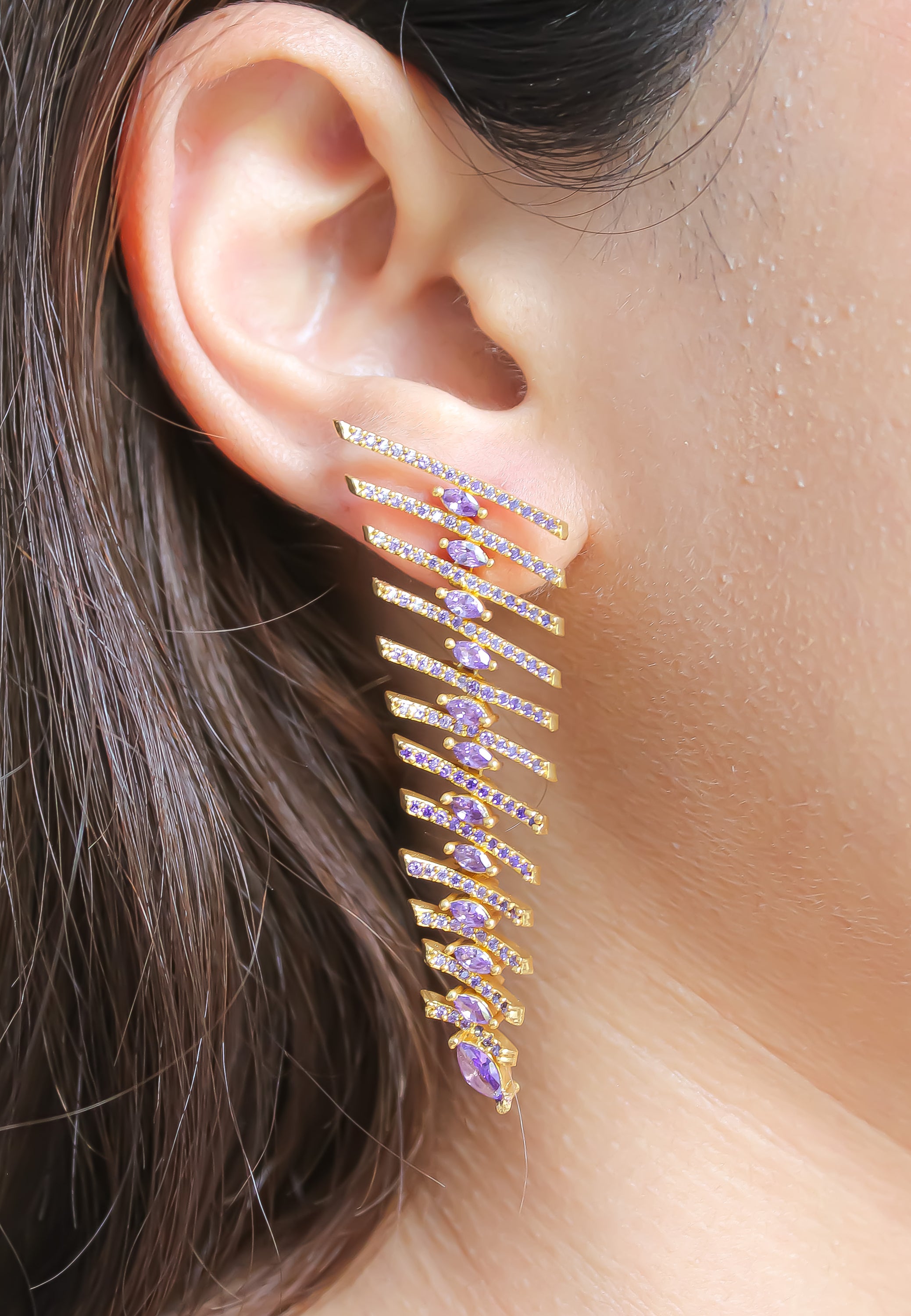 Elegant Fishbone Earrings in gold, silver, and rose-gold plating with zirconia stones, showcasing a modern design.