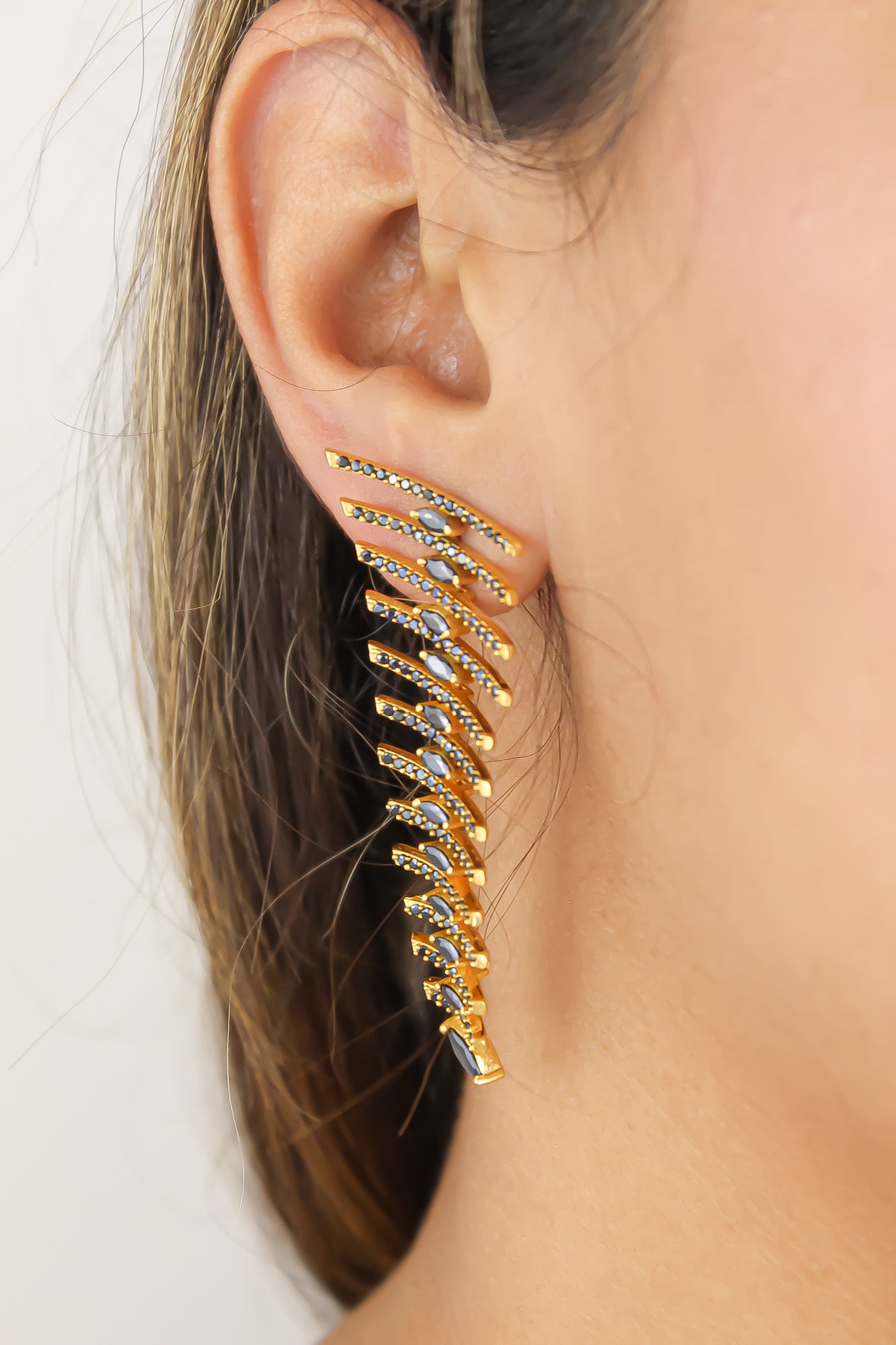 Elegant Fishbone Earrings in gold, silver, and rose-gold plating with zirconia stones, showcasing a modern design.