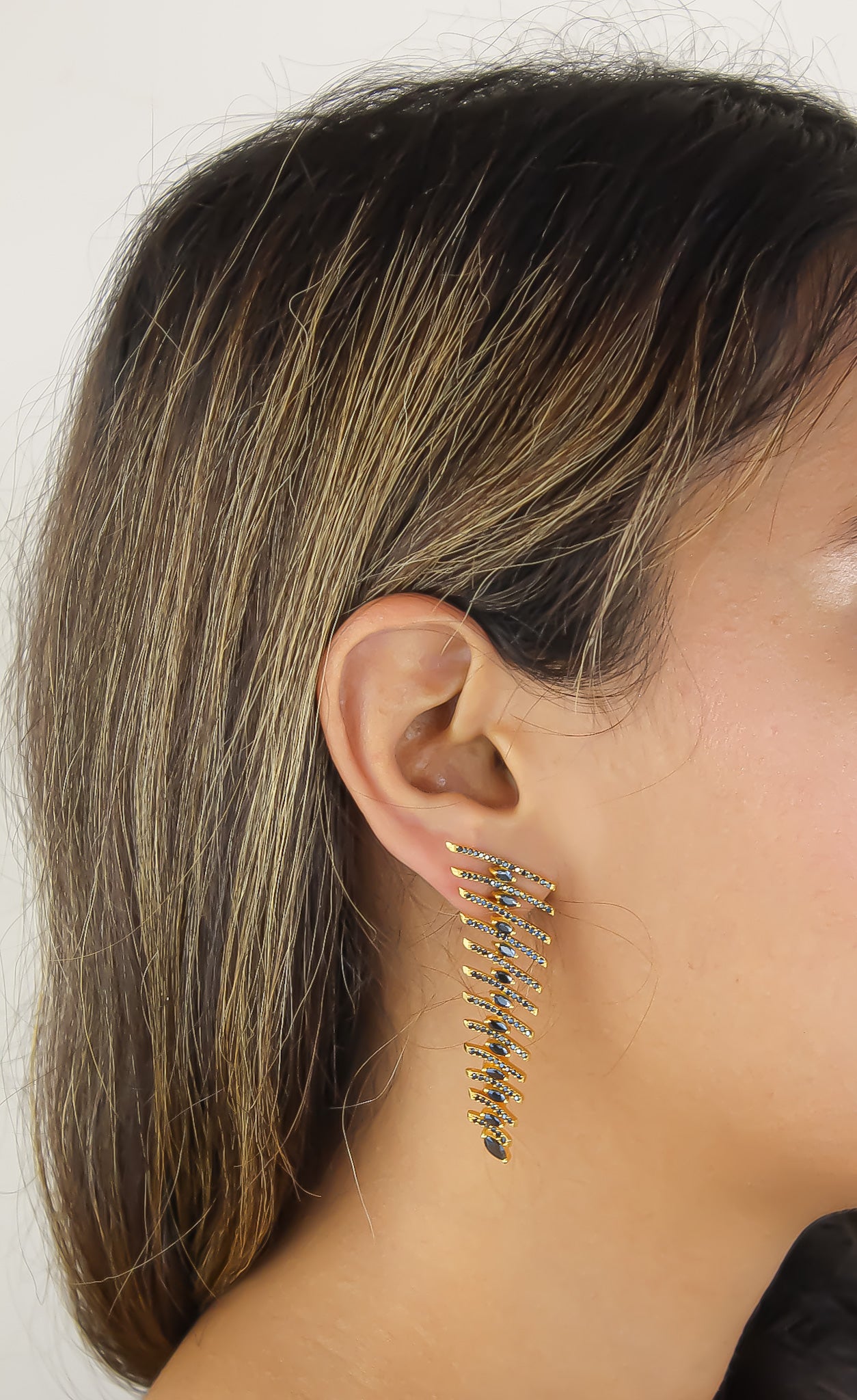 Elegant Fishbone Earrings in gold, silver, and rose-gold plating with zirconia stones, showcasing a modern design.