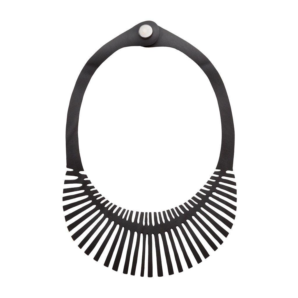 Fishbone Inner Tube Necklace made from reclaimed rubber, featuring a playful design and lightweight construction, ideal for eco-conscious fashion.