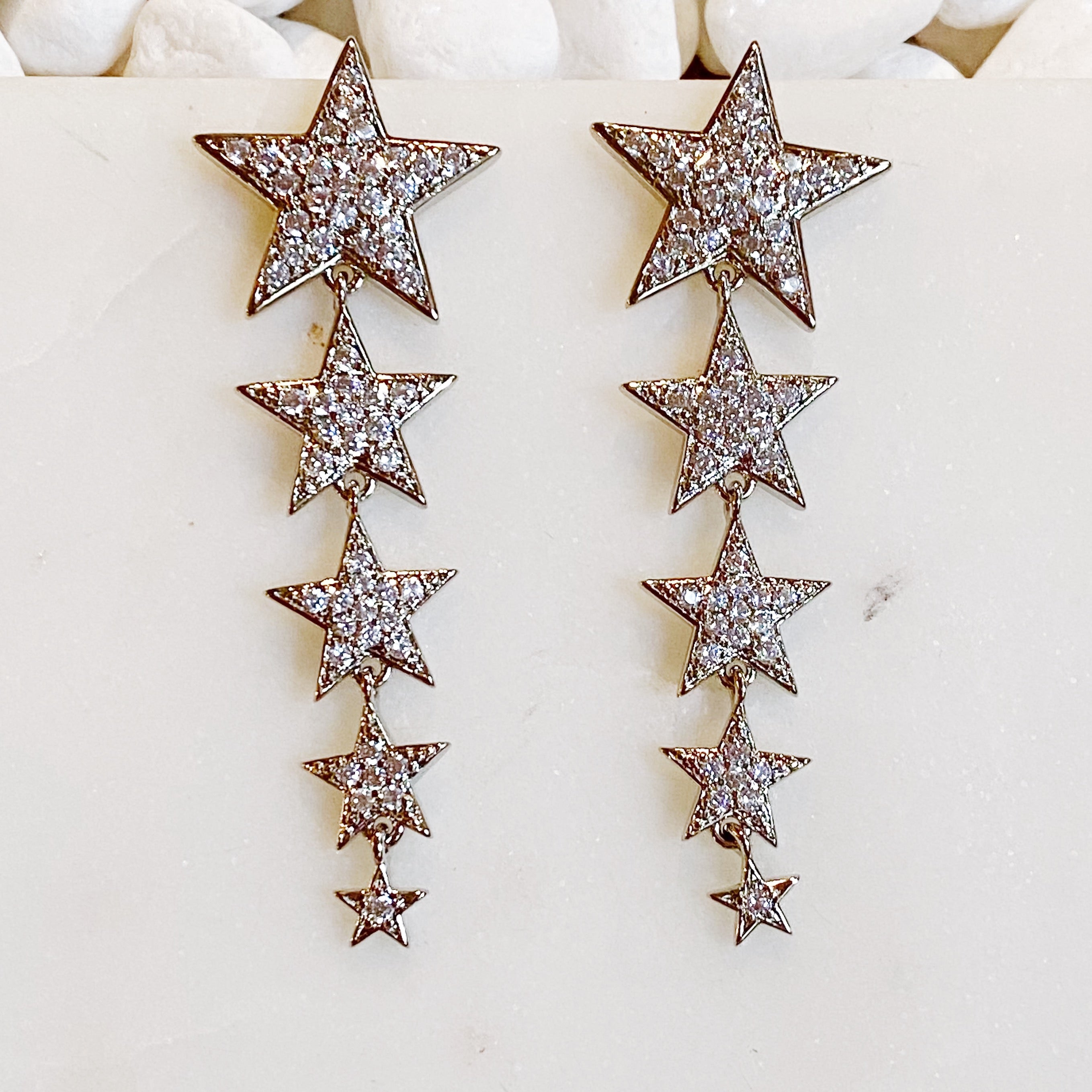 Five Stars Dangle Down Earrings featuring five sparkling stars with cubic zirconia, rhodium plated brass, elegant and fun design.