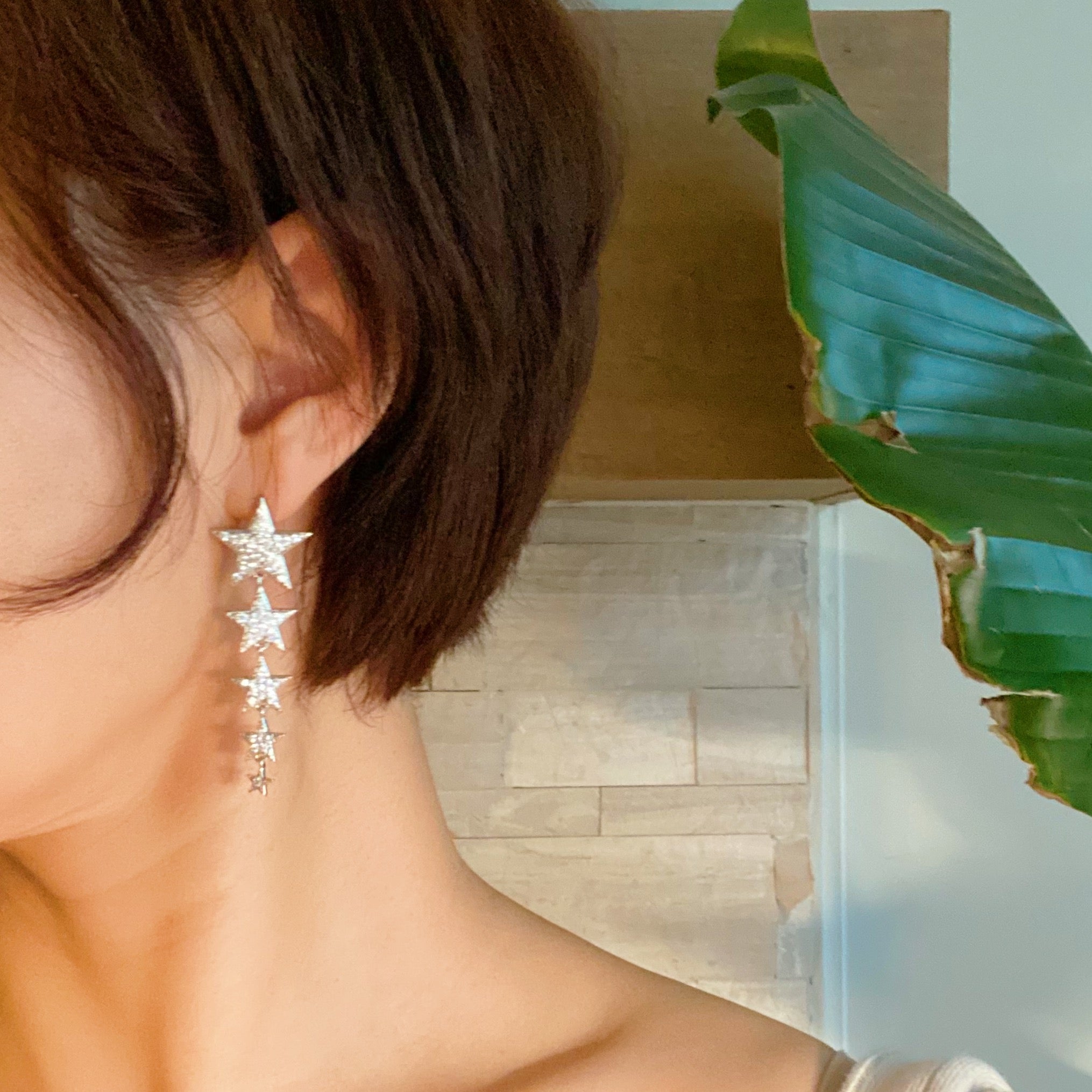 Five Stars Dangle Down Earrings featuring five sparkling stars with cubic zirconia, rhodium plated brass, elegant and fun design.