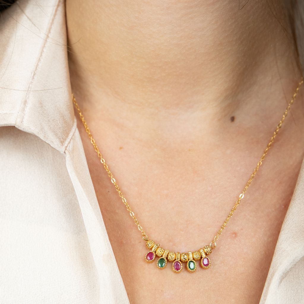 Five Stone Dangle Necklace featuring colorful stones on a gold brass chain, elegantly designed for modern women.