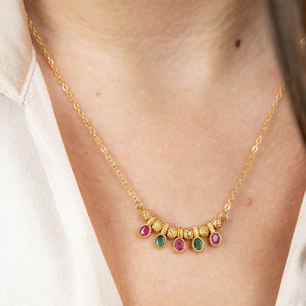 Five Stone Dangle Necklace featuring colorful stones on a gold brass chain, elegantly designed for modern women.