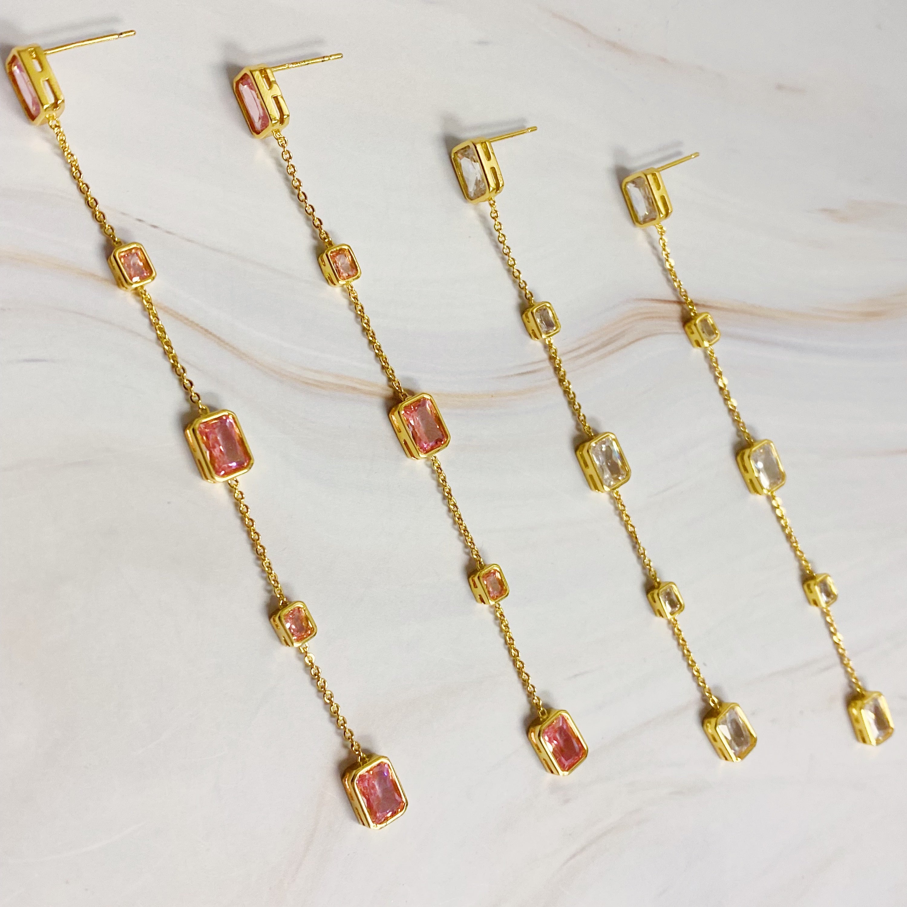 Elegant Five Stones Dangle Drop Earrings featuring sparkling cubic zirconia stones set in gold plated brass.