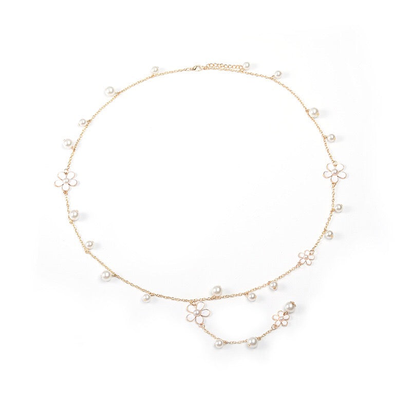 A beautiful five-petal flower necklace adorned with pearls, showcasing elegance and charm, perfect for sweaters.