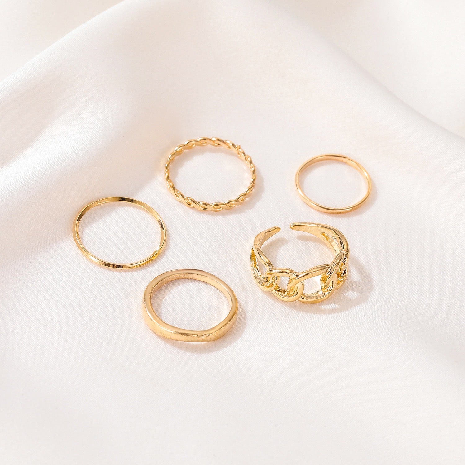 Five-Piece Ring Set featuring unique designs made from durable alloy, showcasing various sizes and styles for versatile wear.